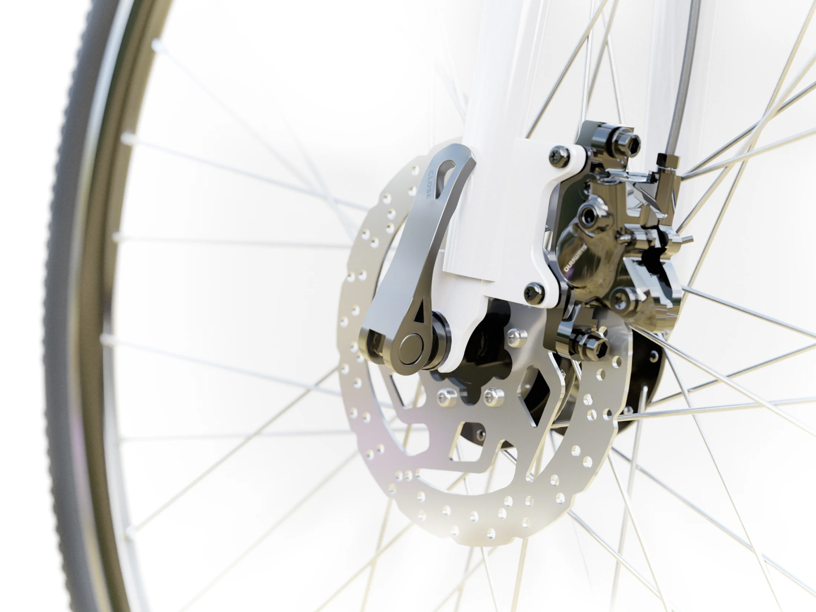 Nahaufnahme des Fahrrad-Scheibenbremssattels und der Felge mit Speichen.