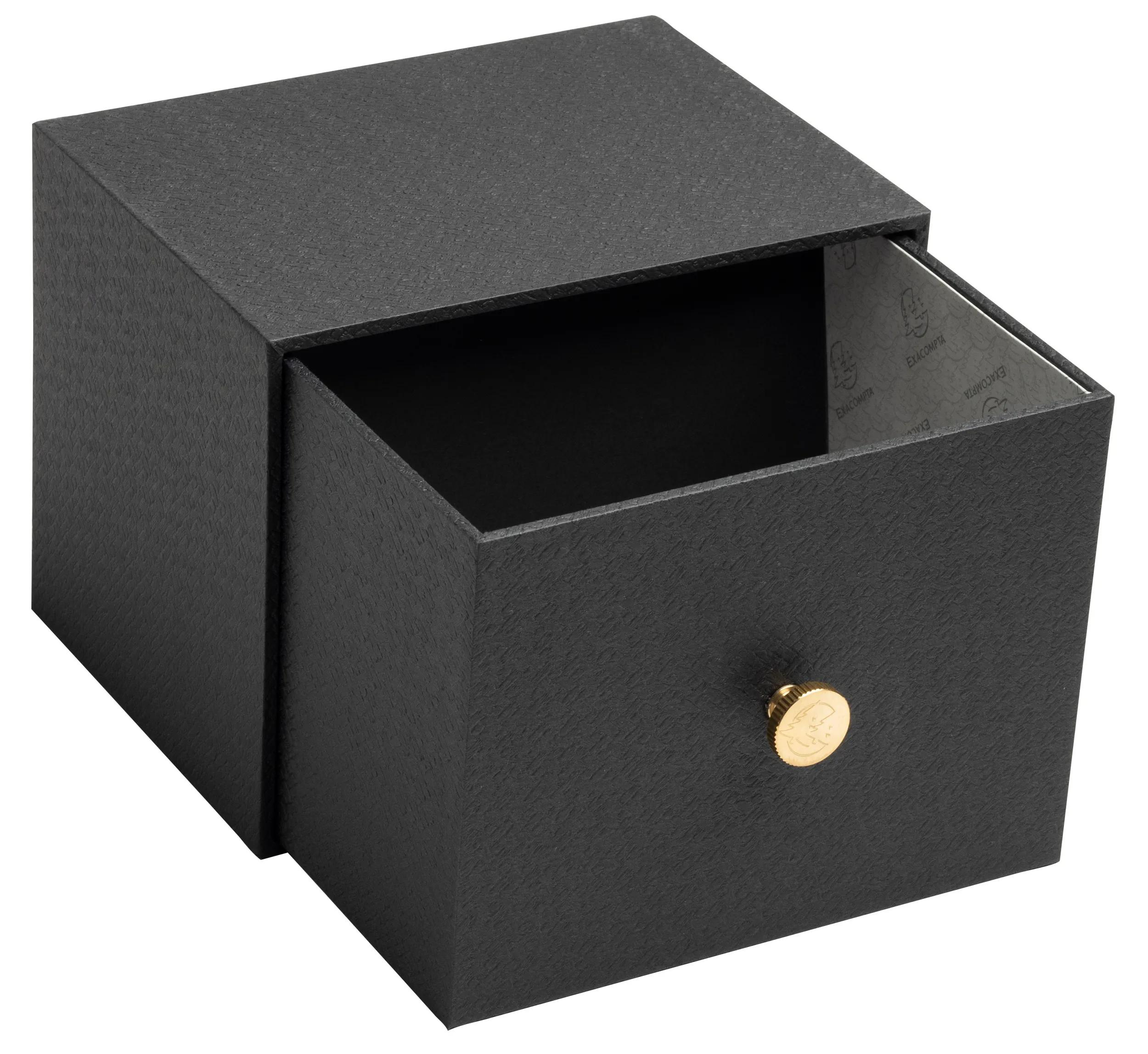 Caja negra texturizada con cajón parcialmente abierto y pomo dorado.