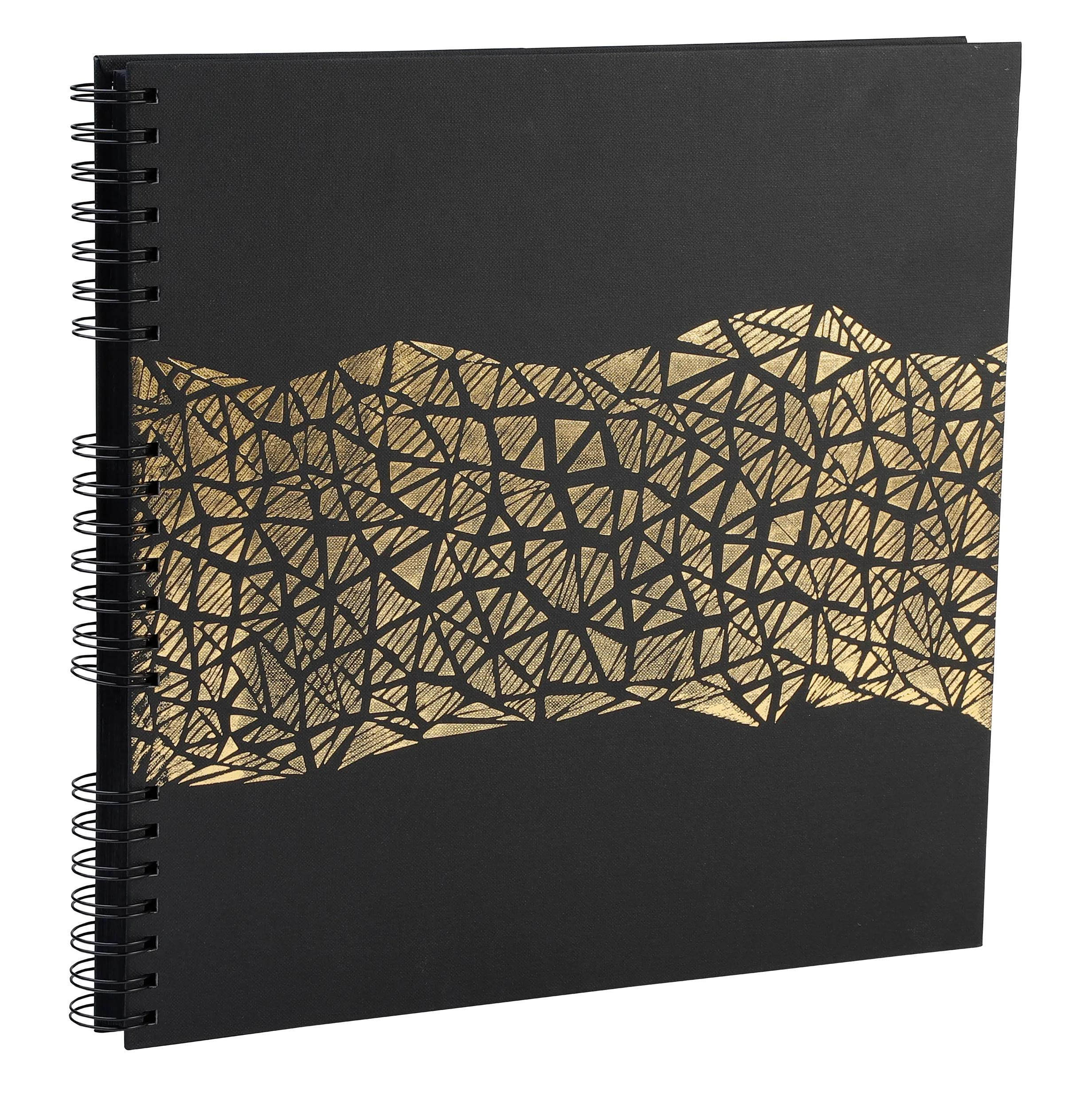 Cuaderno negro con espiral y patrón abstracto dorado en la portada.