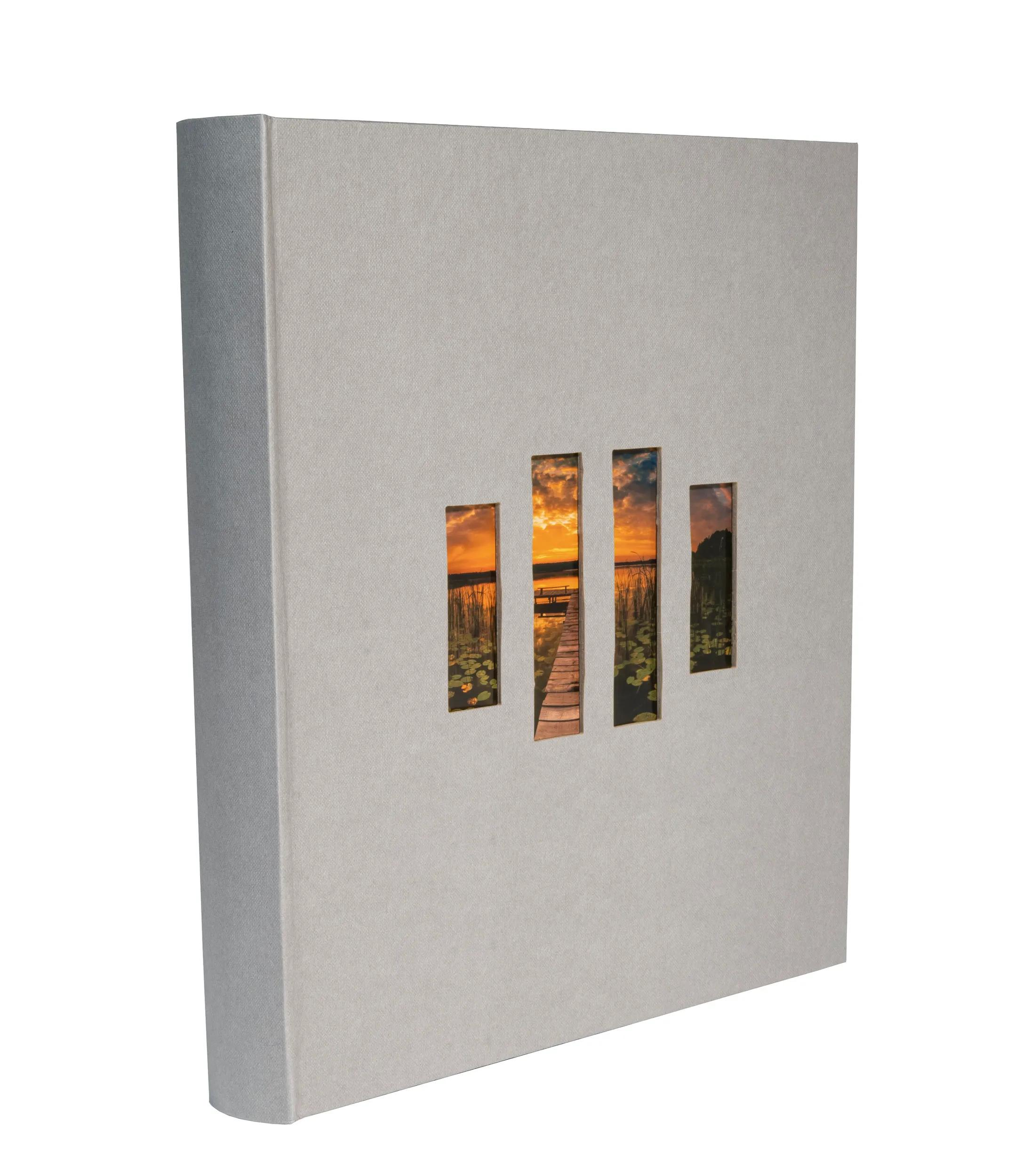 Libro gris con cuatro recortes que muestran un atardecer sobre un lago con un muelle.