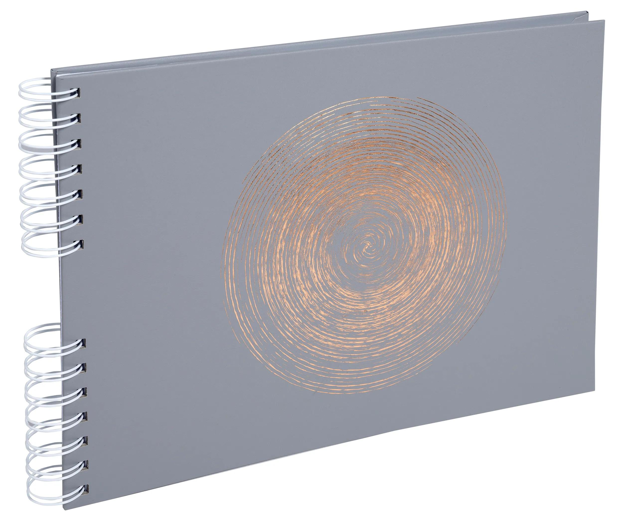 Cuaderno gris con espiral y diseño de remolino en cobre.