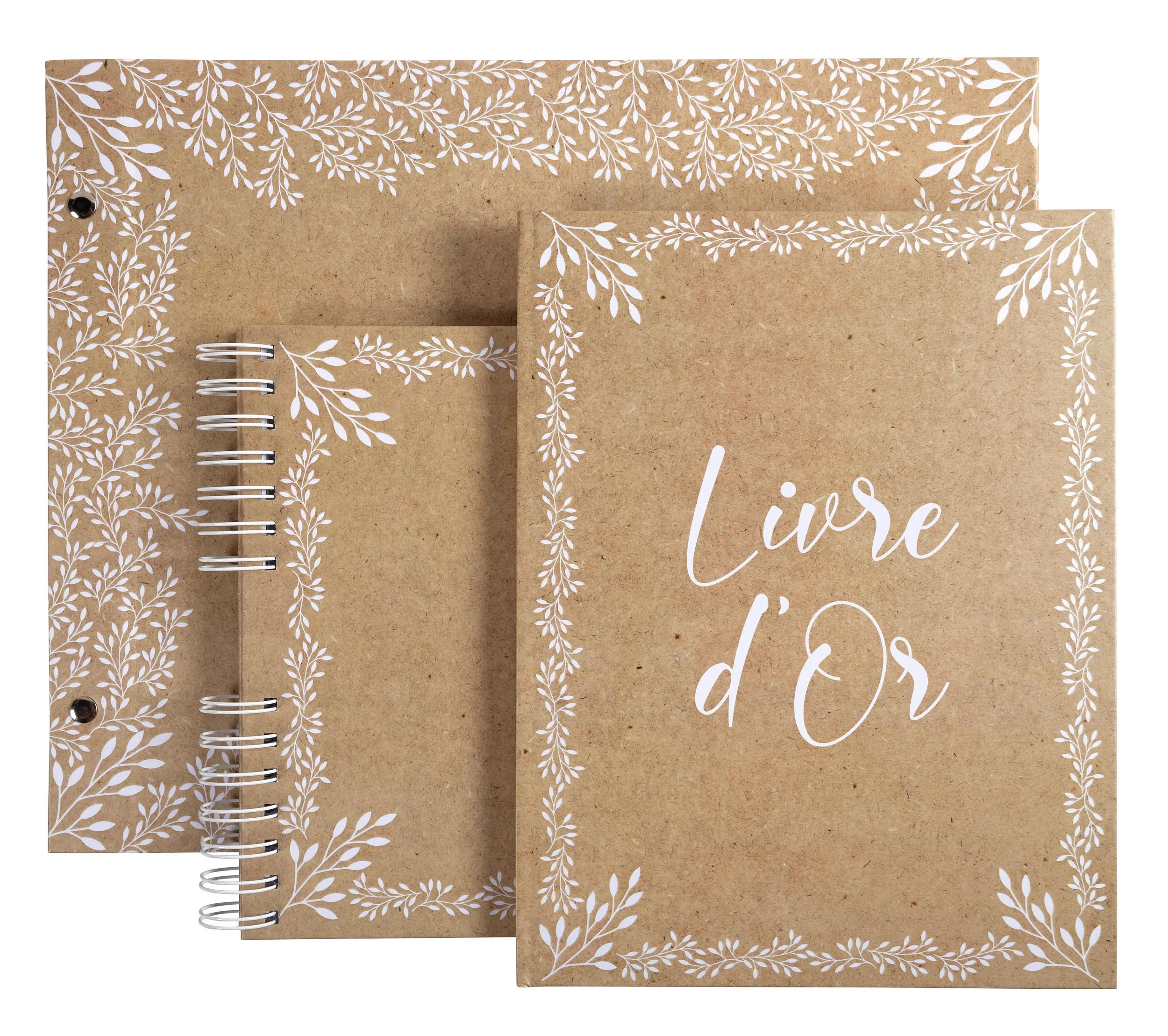 Cuaderno marrón con patrón de hojas blancas y espiral. Texto 'Livre d'Or'.