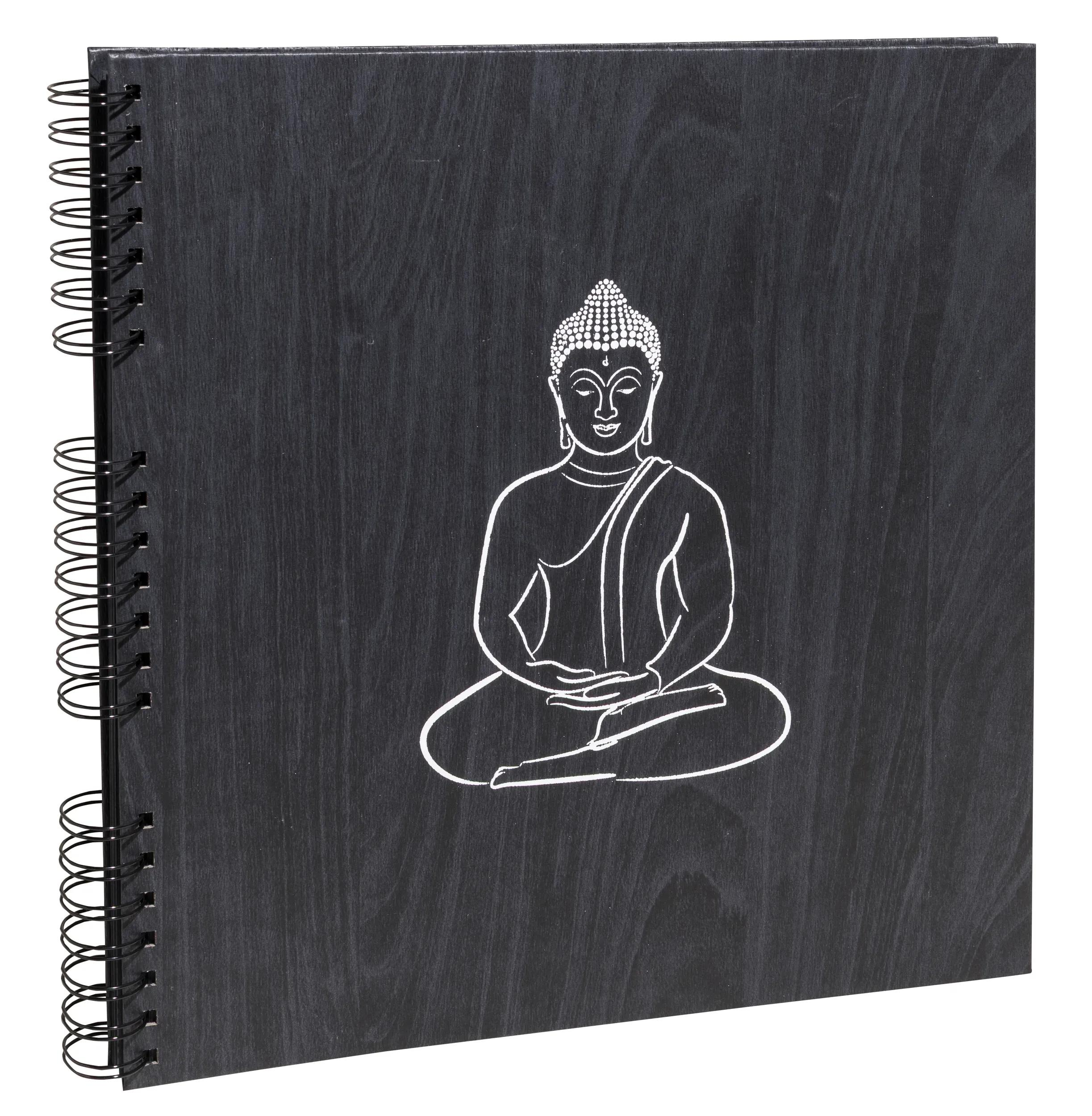 Cuaderno negro con espiral y silueta blanca de Buda.