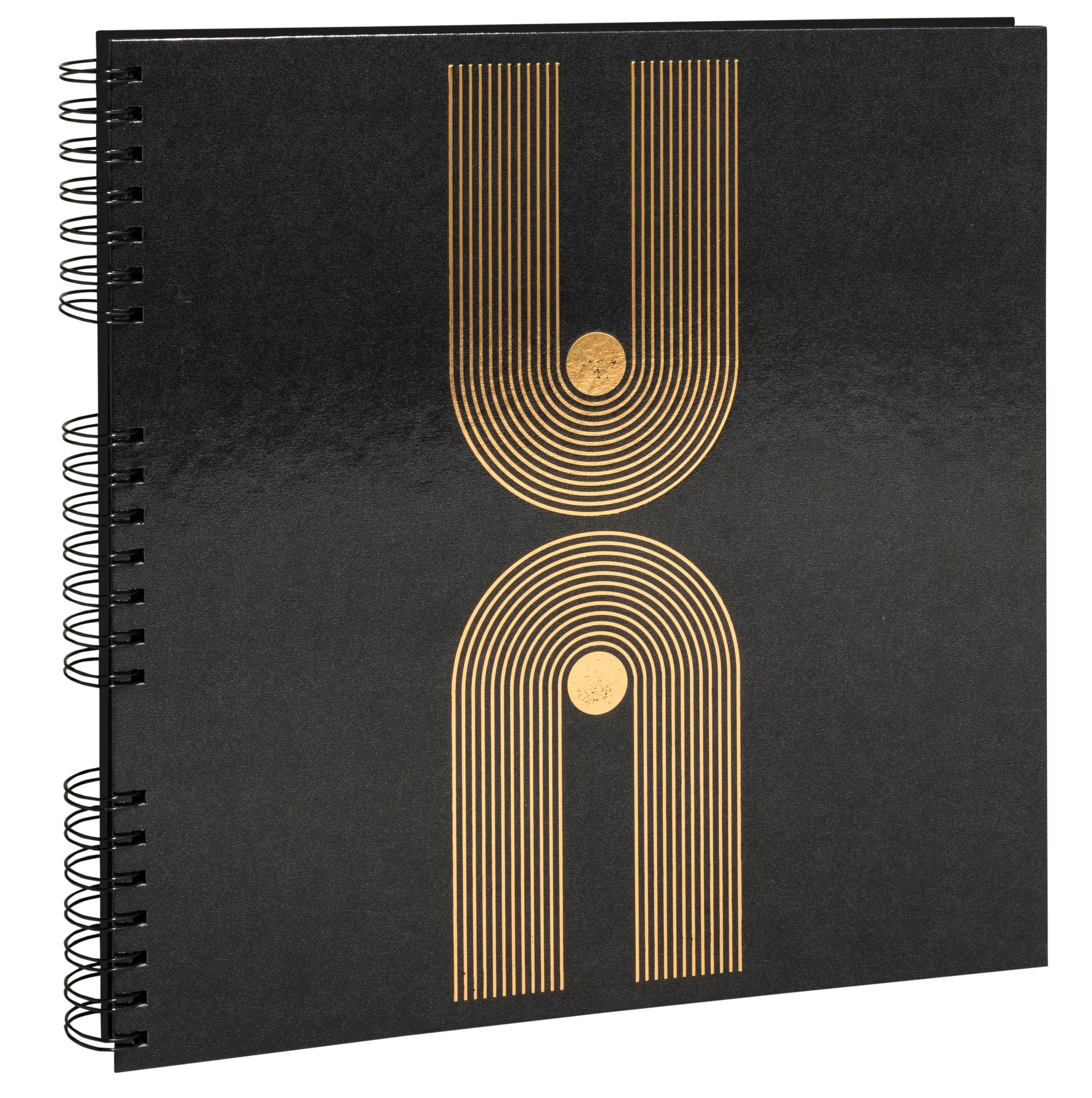 Cuaderno negro con diseño de líneas doradas y espiral.