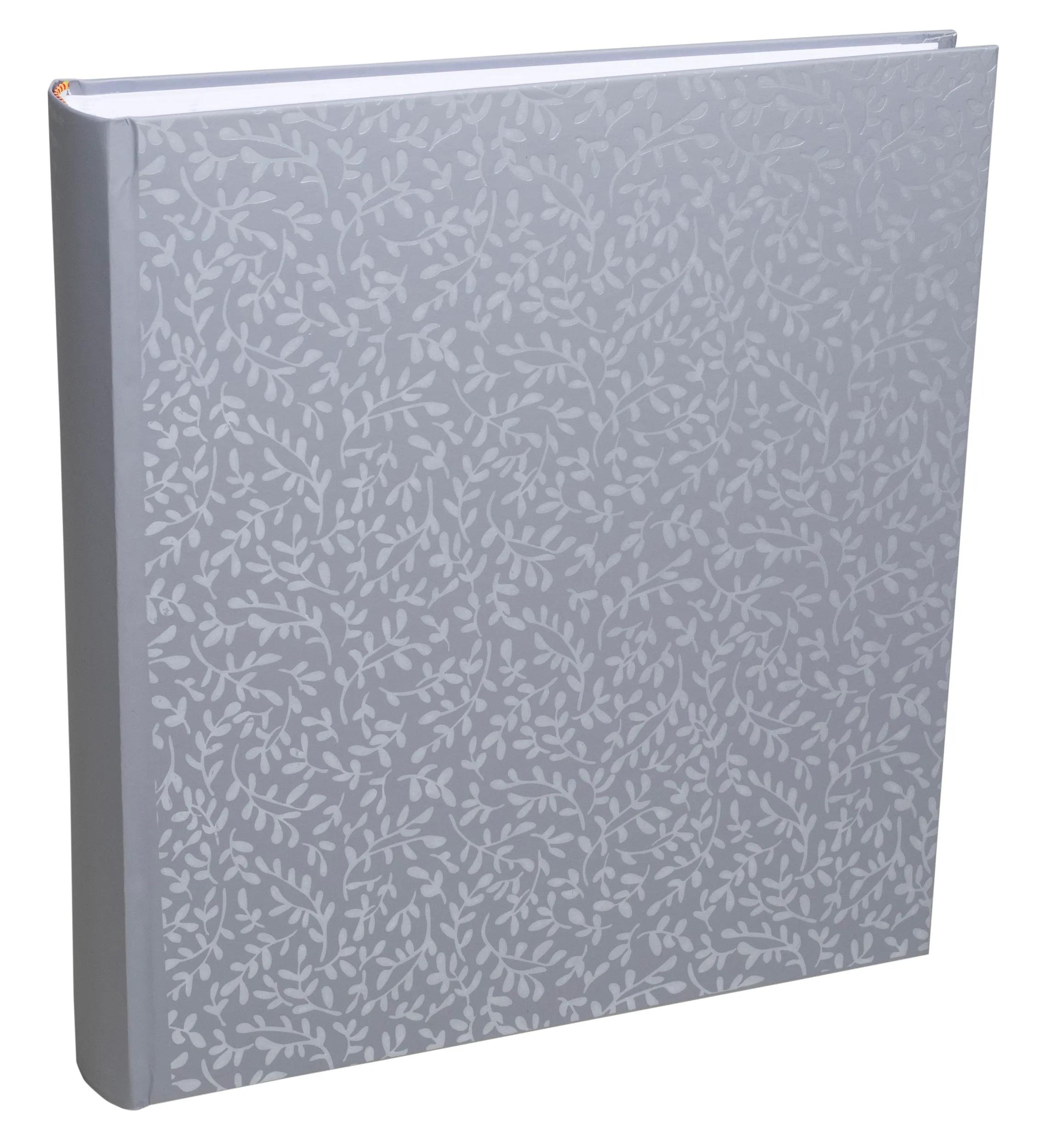 Un libro gris con patrón de hojas, de pie.