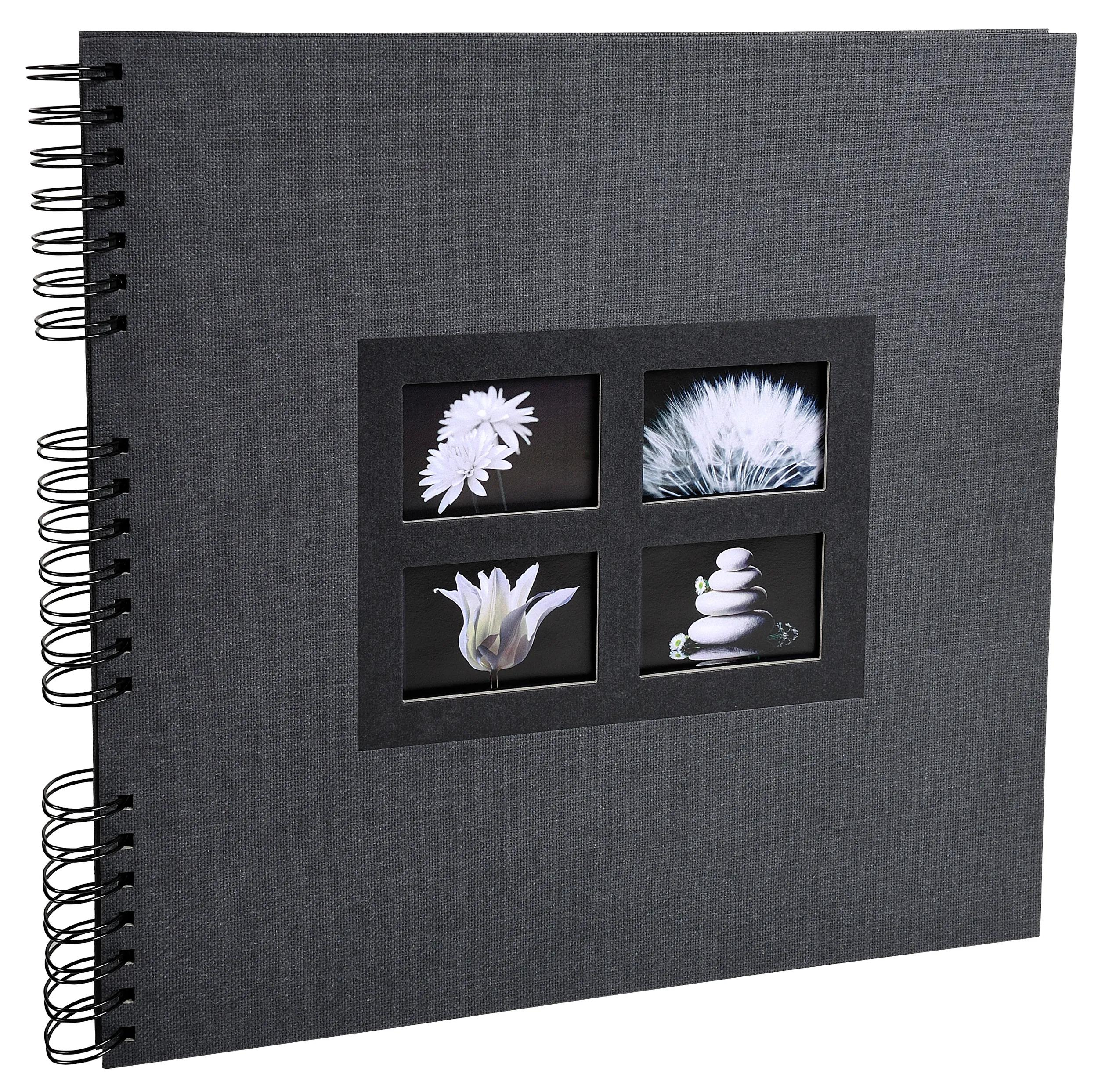 Libreta gris de espiral con cuatro imágenes pequeñas enmarcadas en la portada.