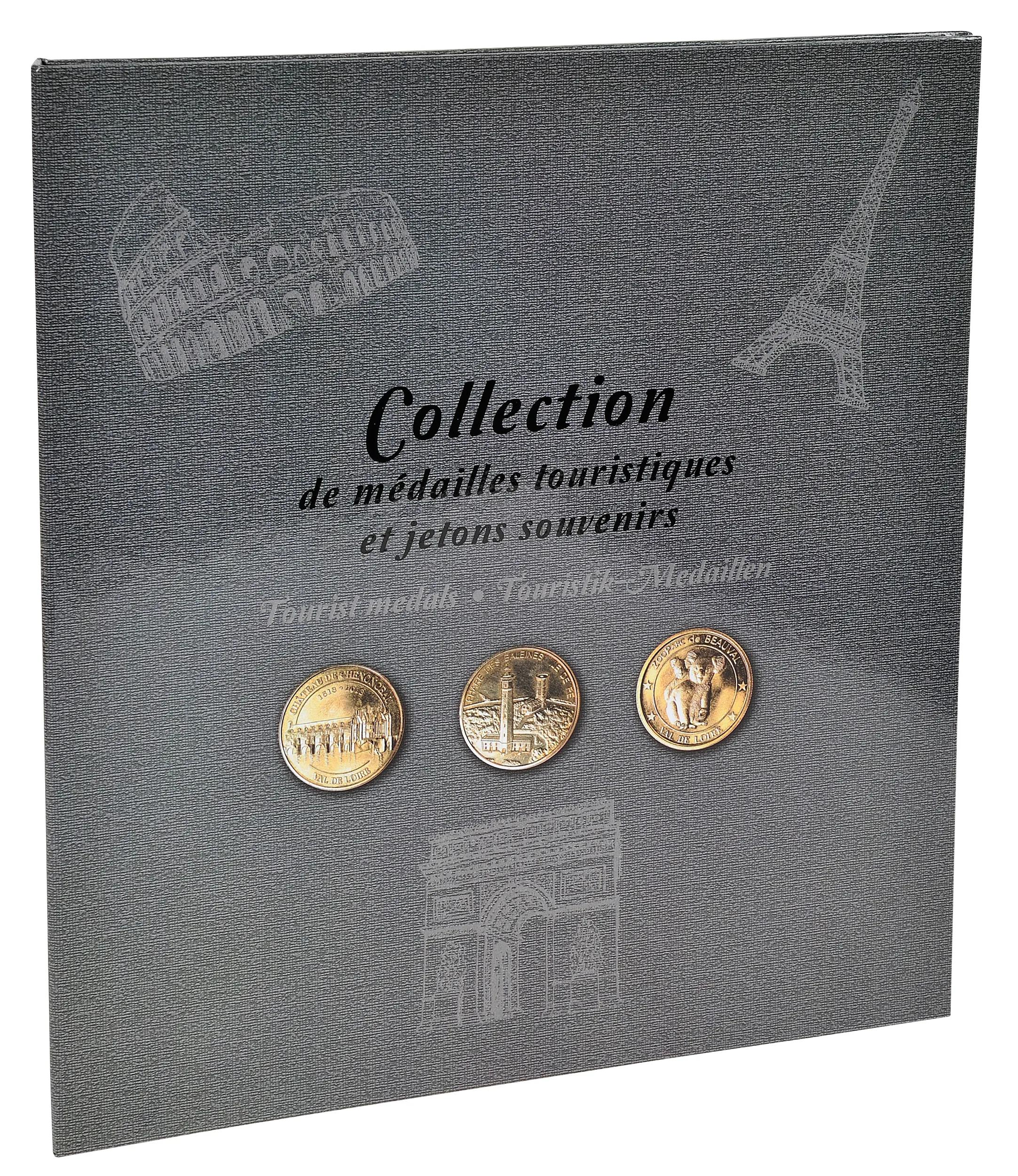 Estuche gris con tres medallas doradas de recuerdo y siluetas de monumentos.