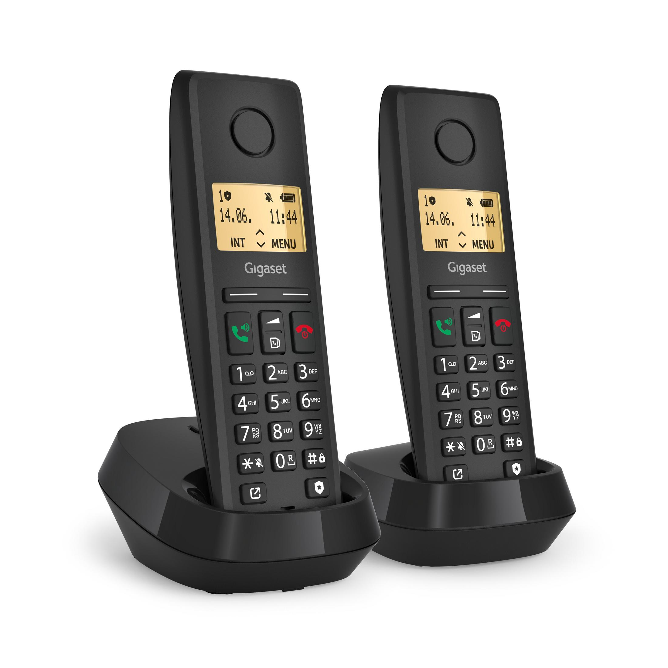 Due telefoni cordless Gigaset neri con basi di ricarica.