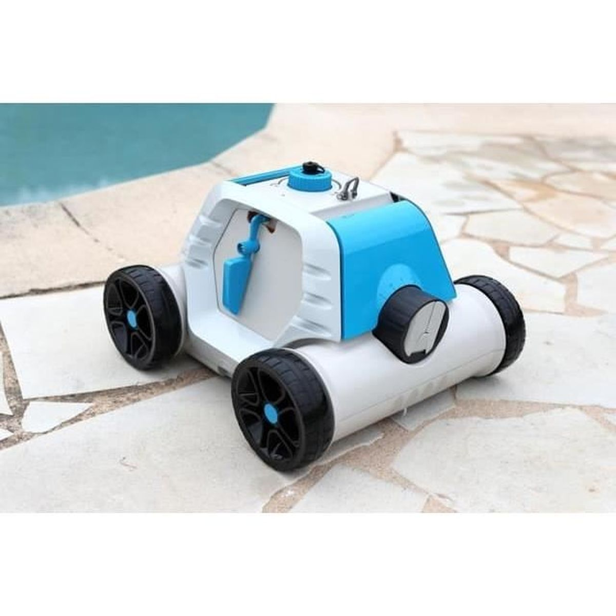 Ein weißer und blauer Poolroboter mit schwarzen Rädern auf Steinplatten.