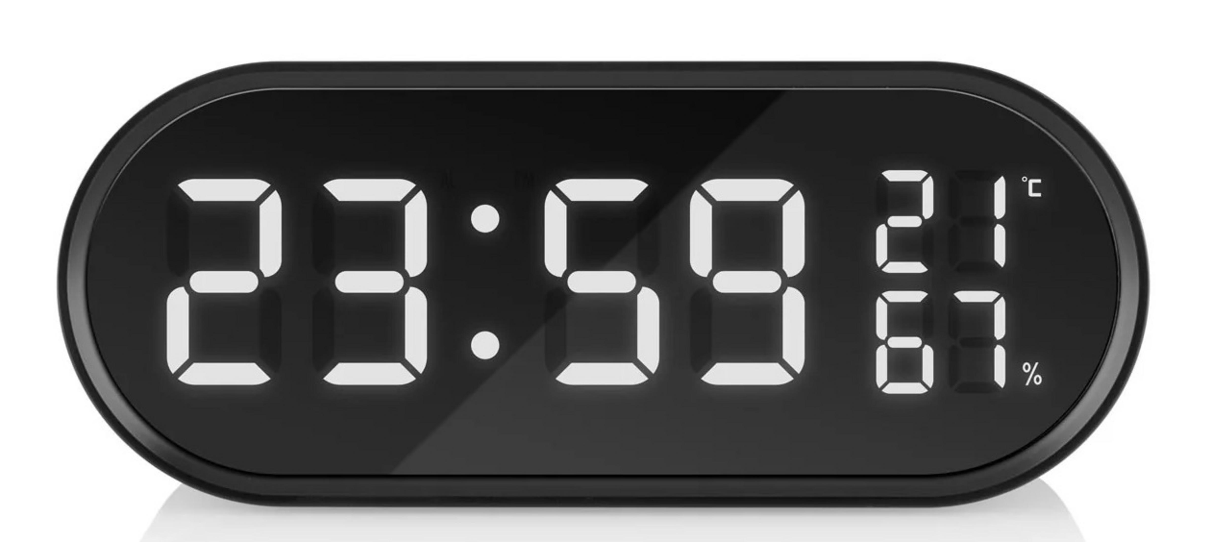 Zegarek cyfrowy pokazuje 23:59, 21°C i 67% wilgotności.