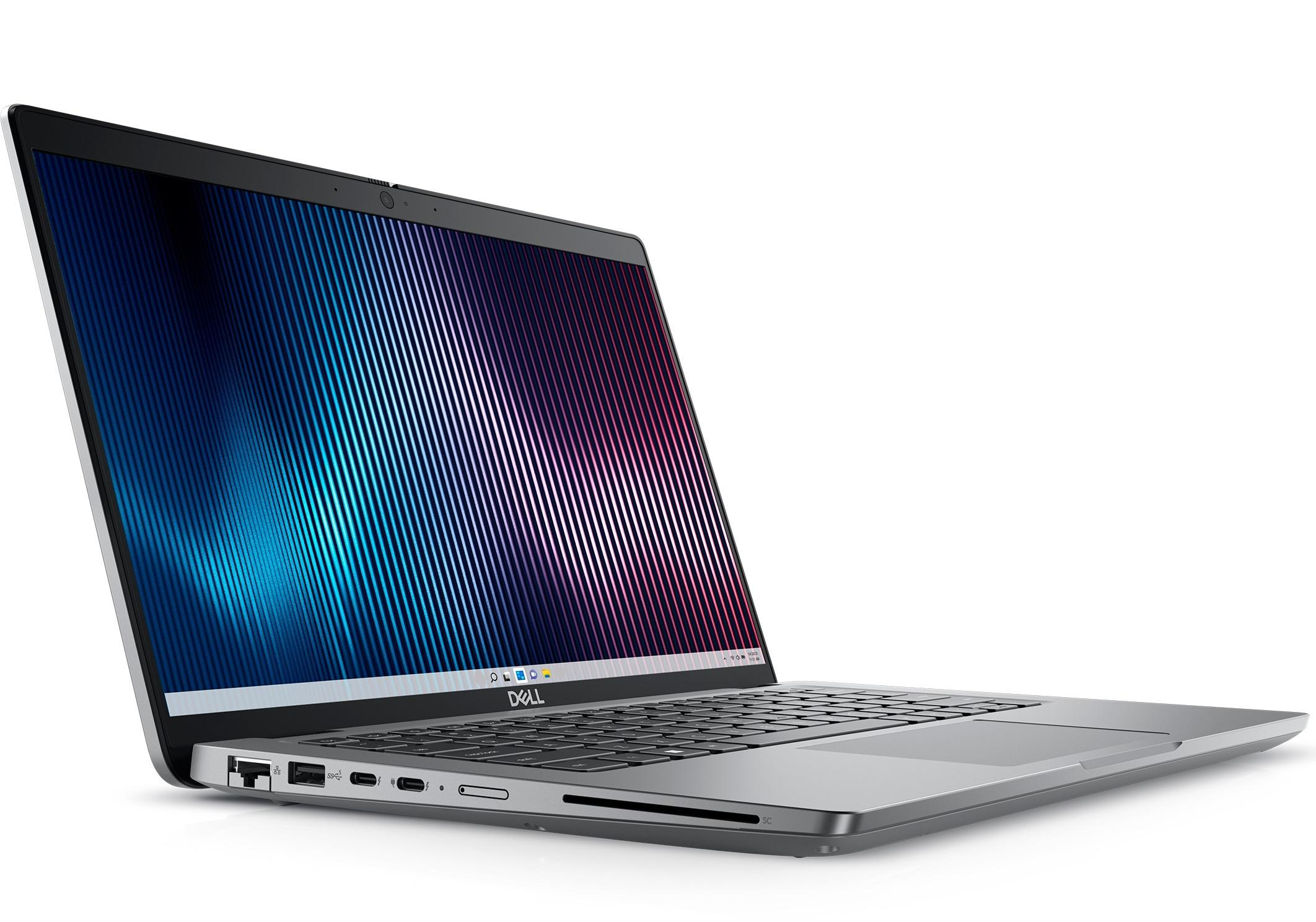 Ein silberner Dell Laptop mit einem abstrakten blauen und lila Hintergrundbild.