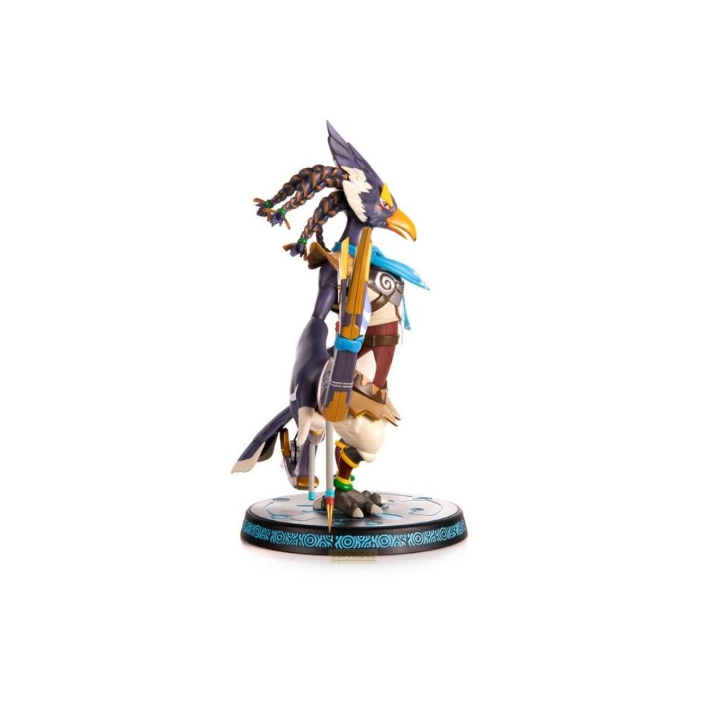 Figurine d'un personnage type oiseau tenant un arc et des flèches sur une base circulaire.