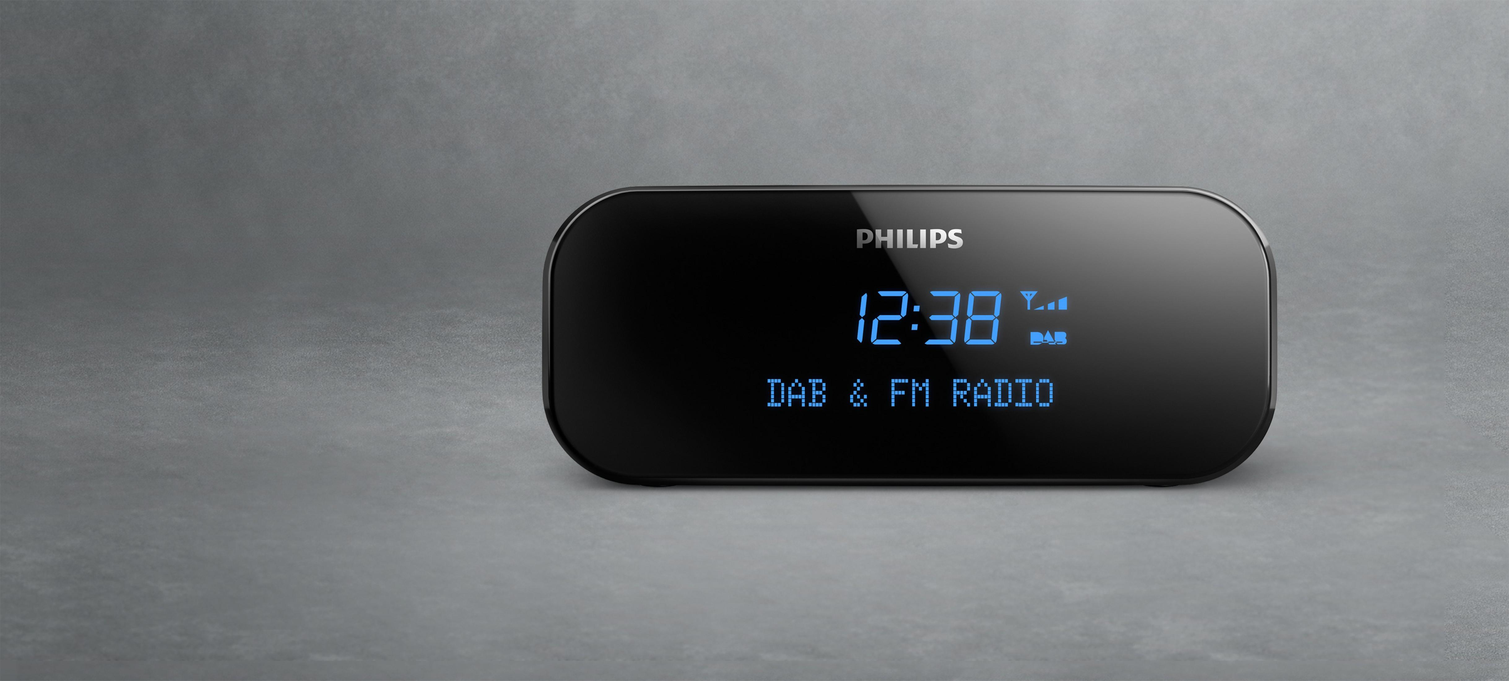 Sveglia nera con display blu che mostra 12:38 e radio DAB & FM.