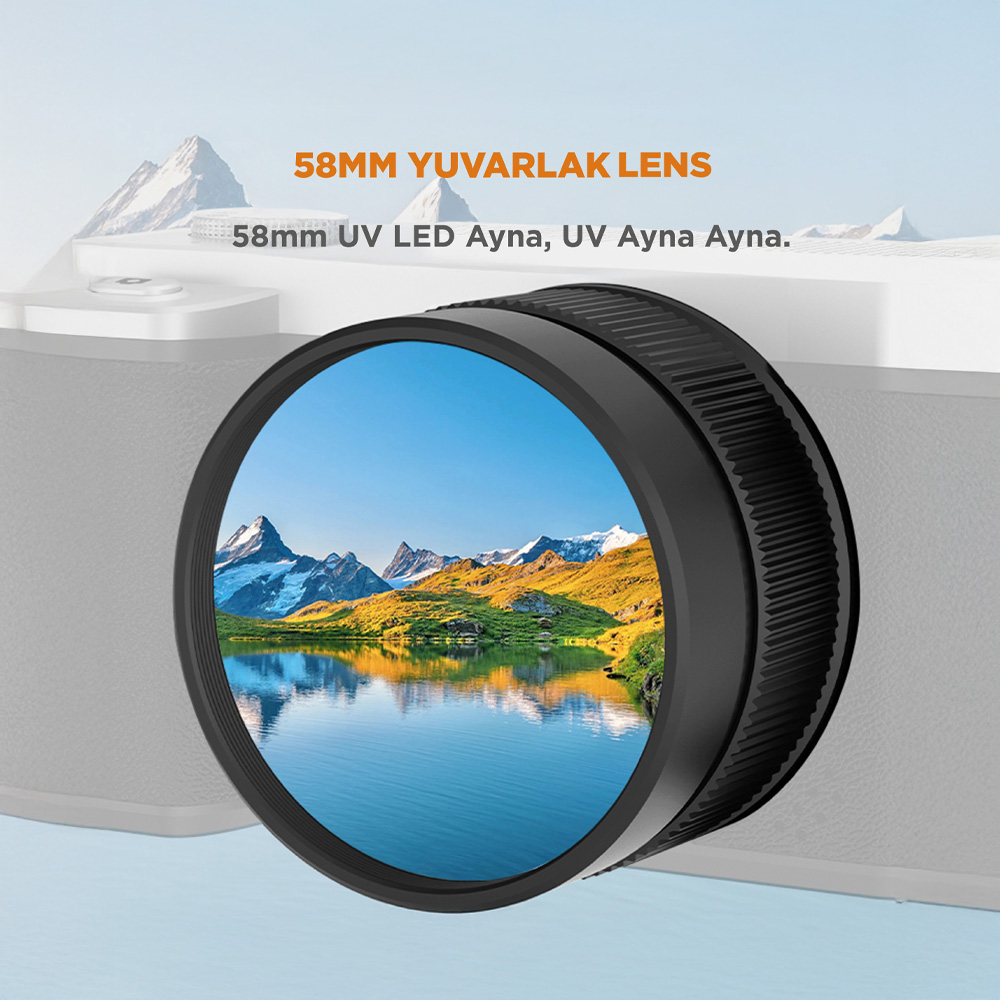 Gri kamera, 58 mm lensli, göl manzaralı dağlık araziyi gösteriyor.