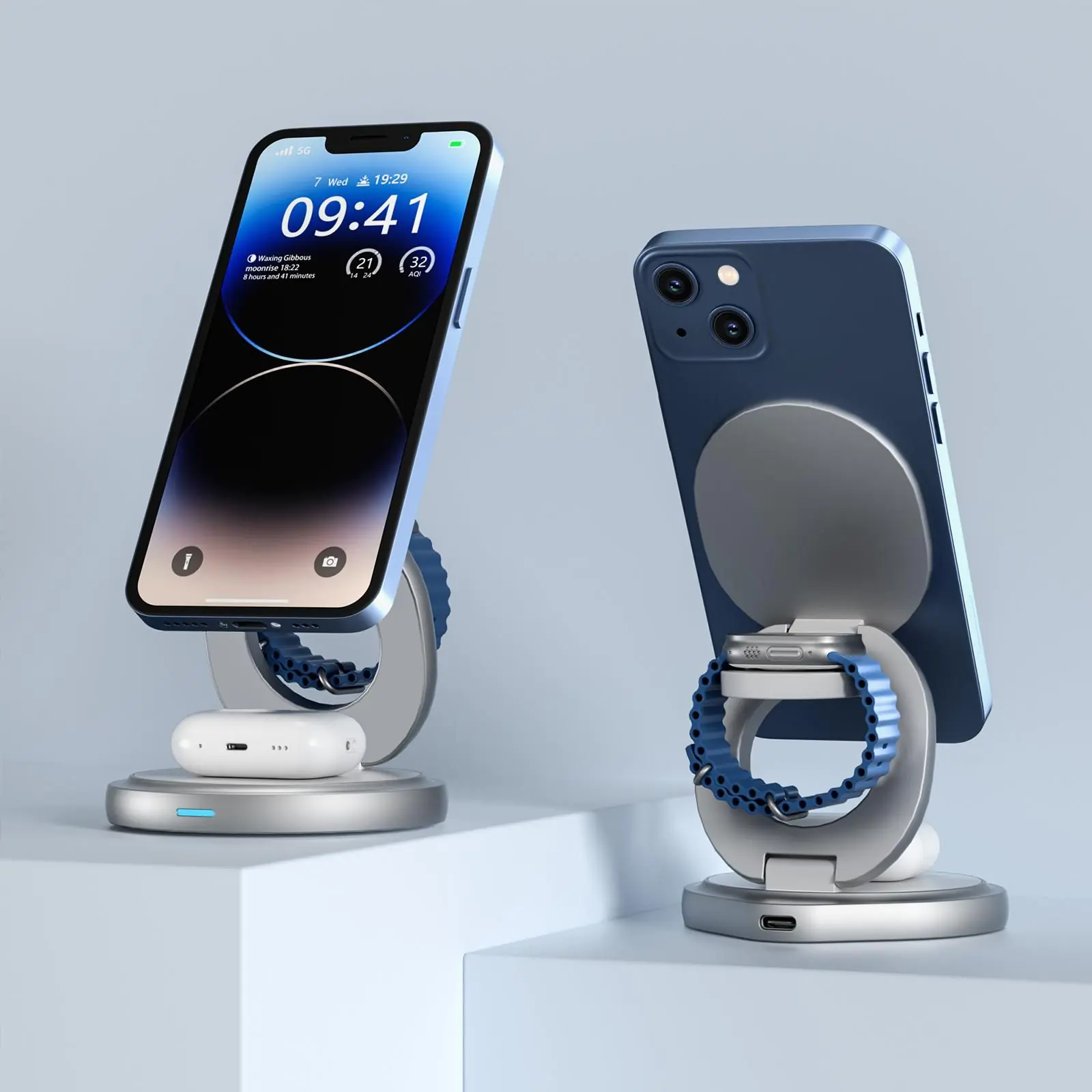 Zwei blaue iPhones und eine Apple Watch auf Ladestationen.