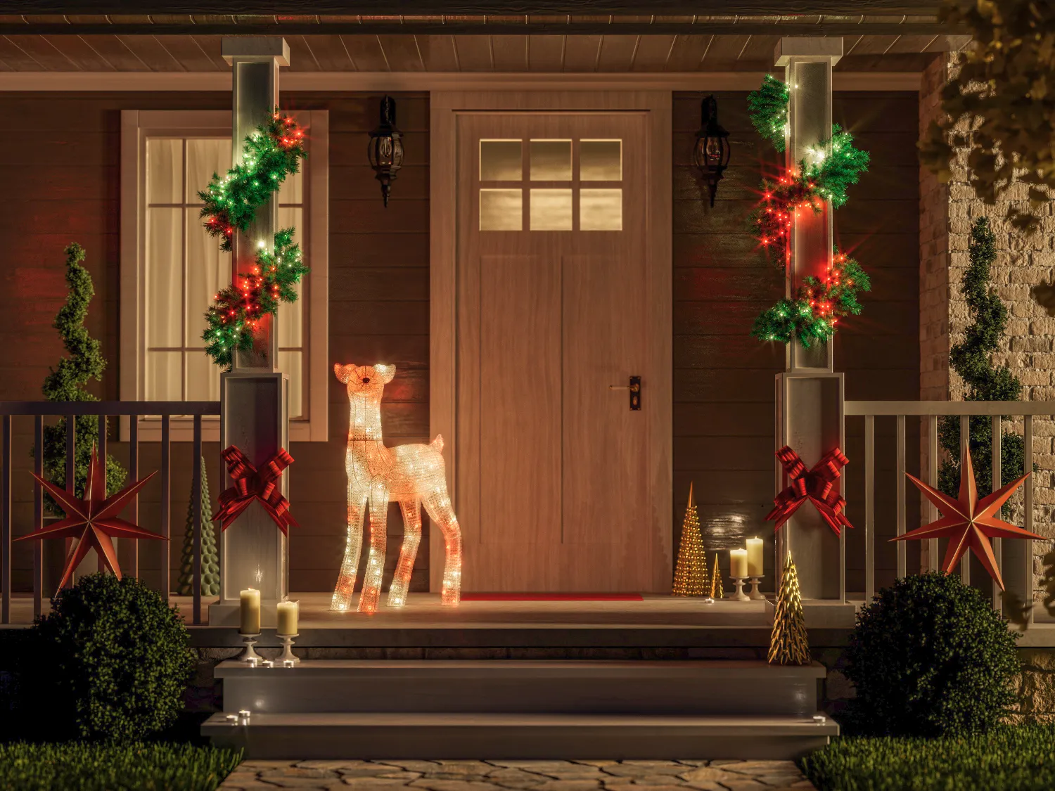 Bożonarodzeniowa dekoracja werandy: świecący renifer, lampki, gwiazdy, drzewka i świece.