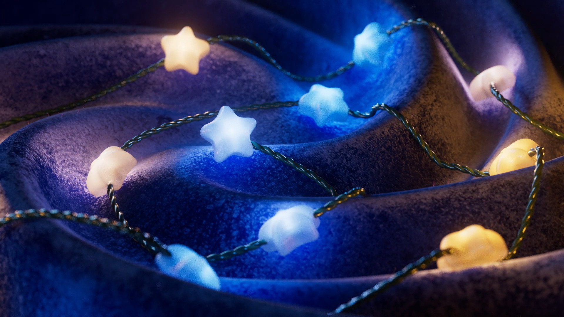 Lampki w kształcie gwiazdek na niebieskiej tkaninie