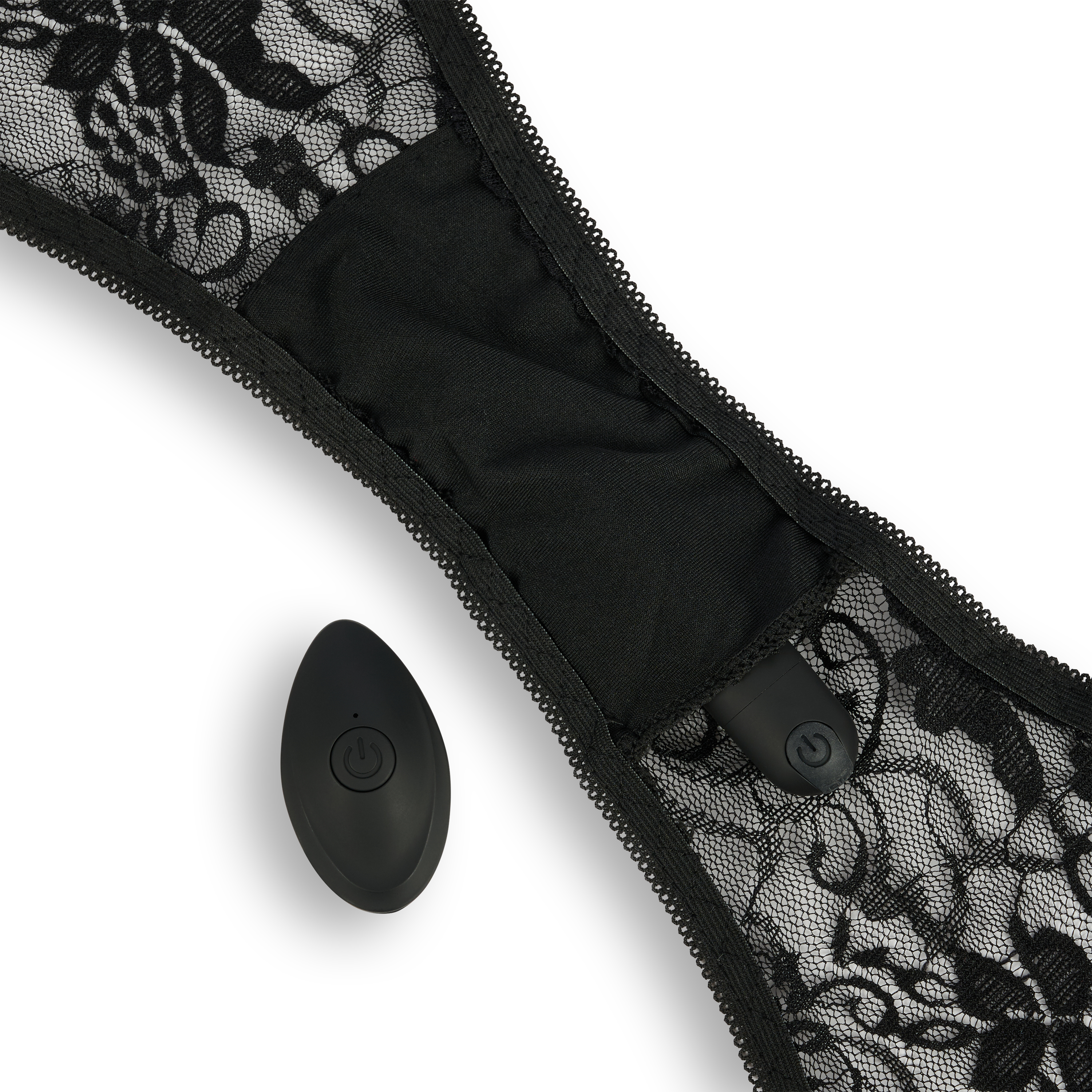 Ropa interior de encaje negro con un dispositivo de control remoto negro.