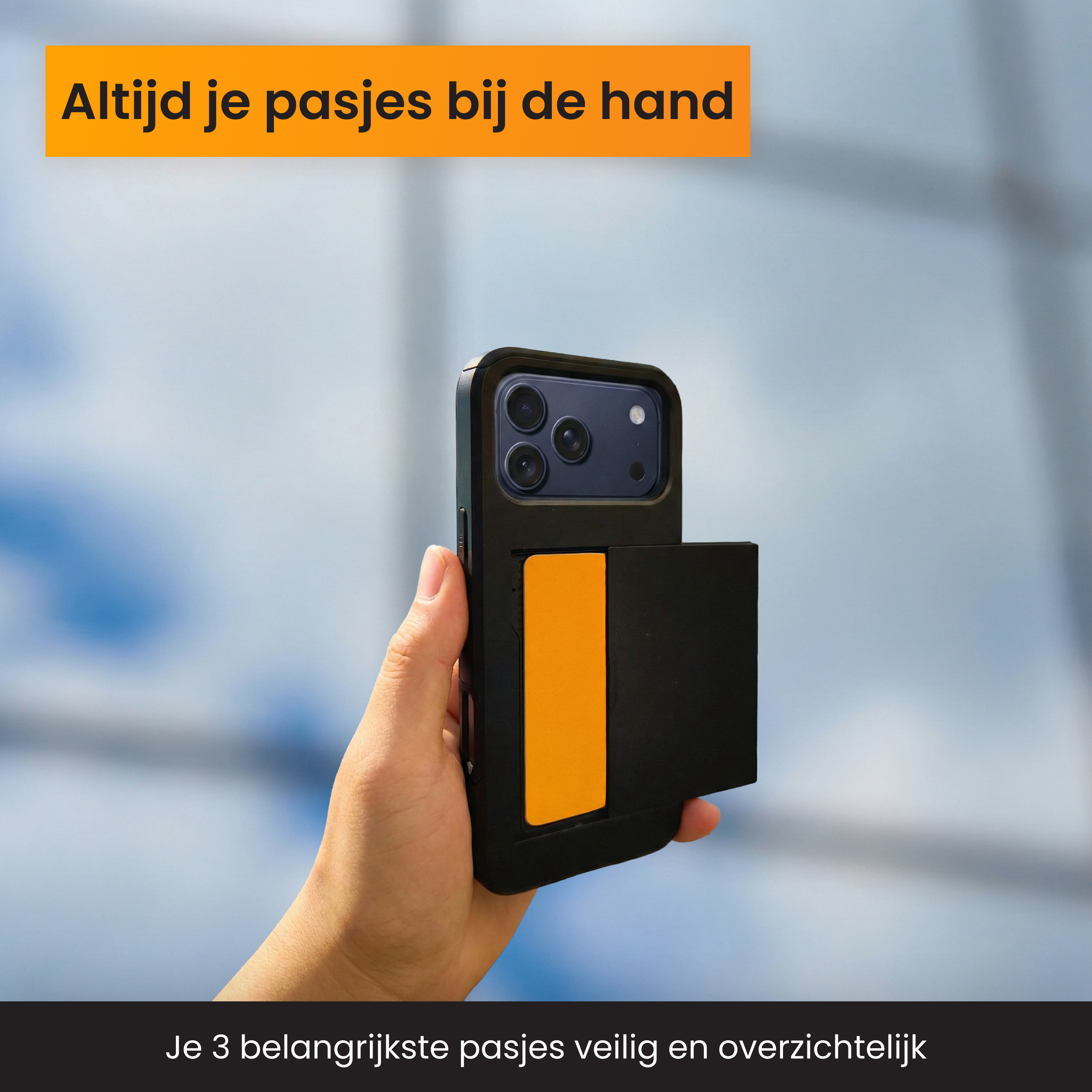 Une main tient un téléphone noir avec un emplacement pour carte orange.