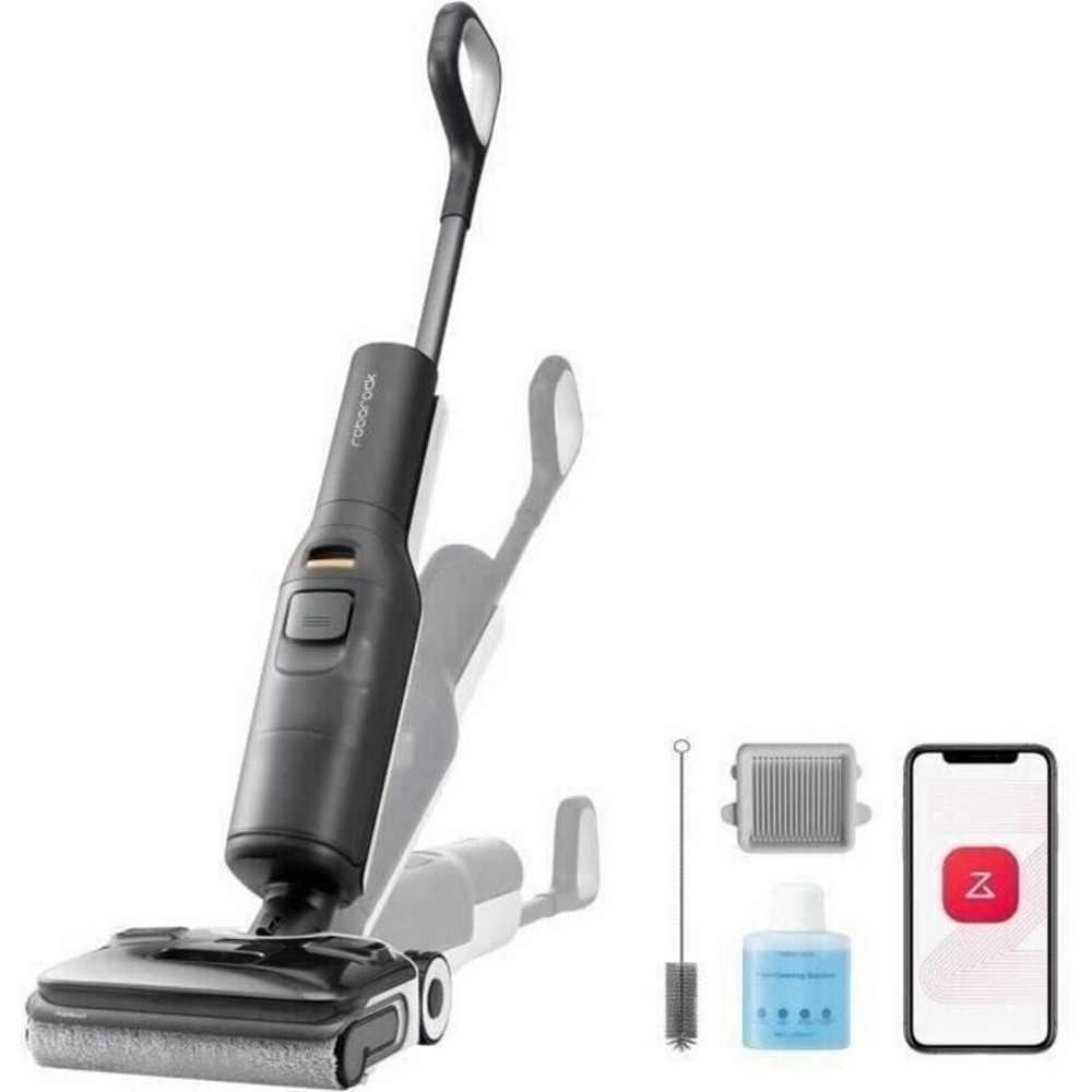 A dark wet/dry vacuum with accessories including a brush, bottle, and smartphone.