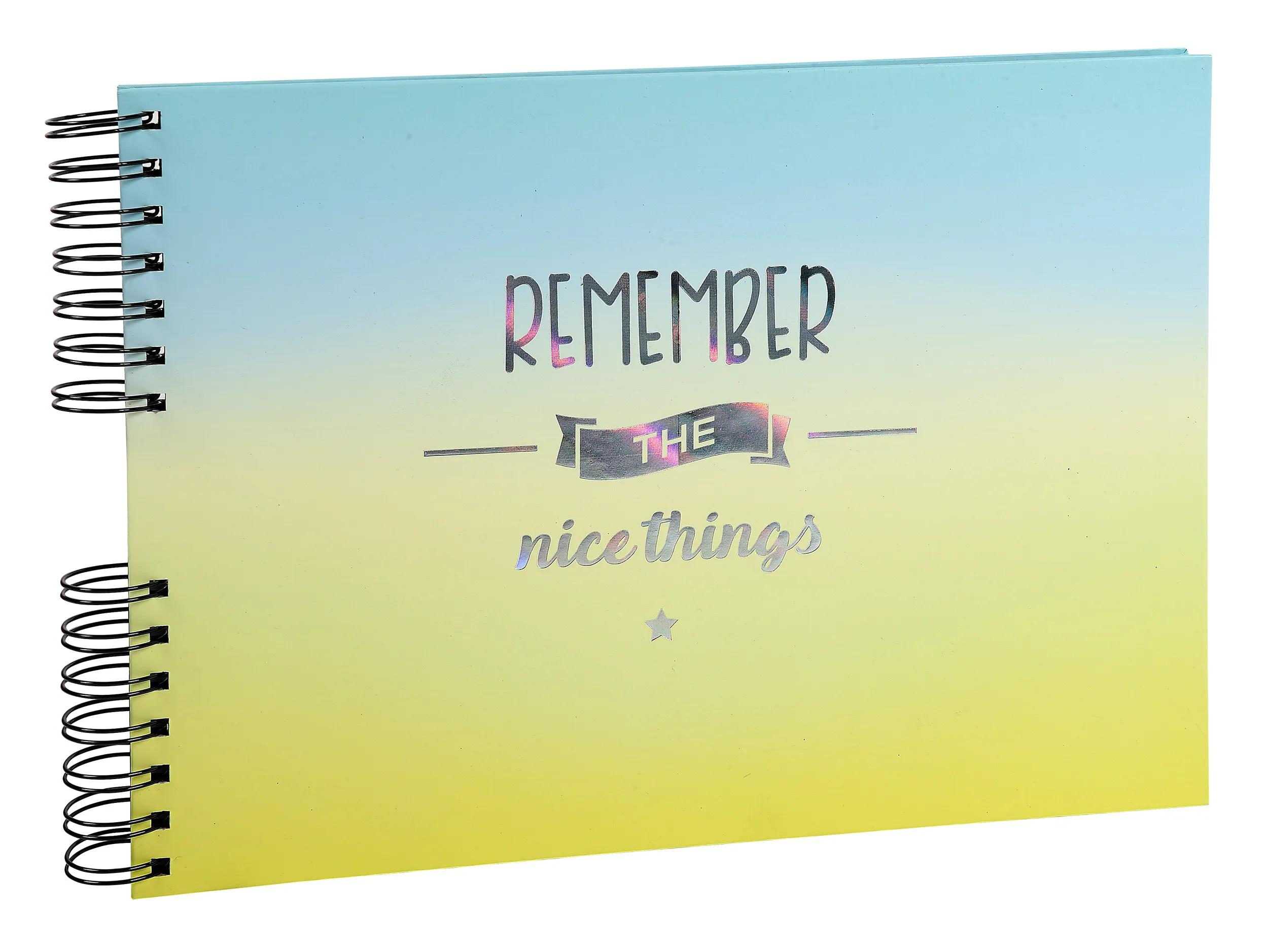 Un cuaderno con espiral, degradado de azul a amarillo, que dice 'Remember the nice things'.