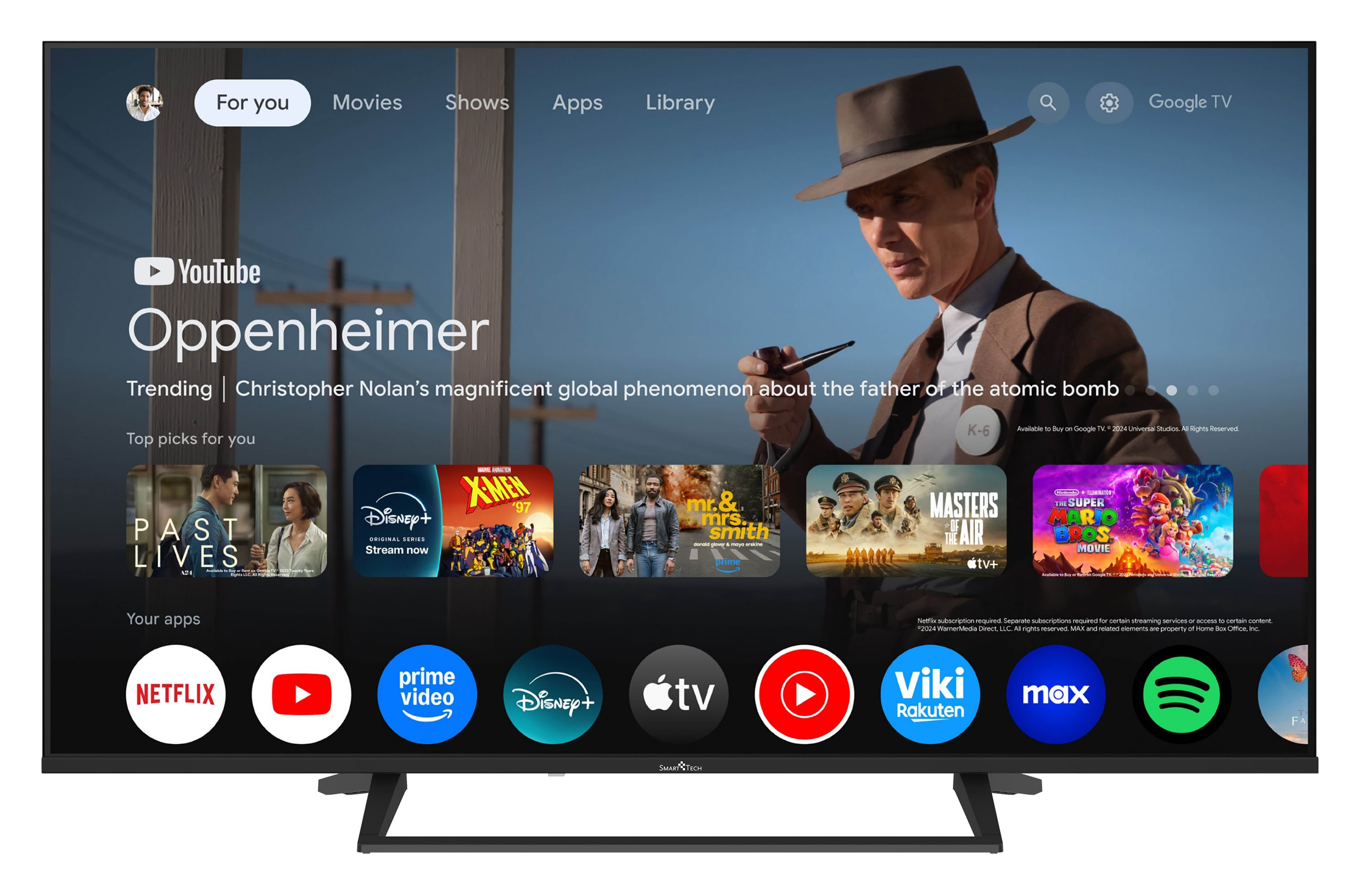 Ein Fernsehbildschirm zeigt die Google TV-Oberfläche mit Filmpostern und App-Symbolen.