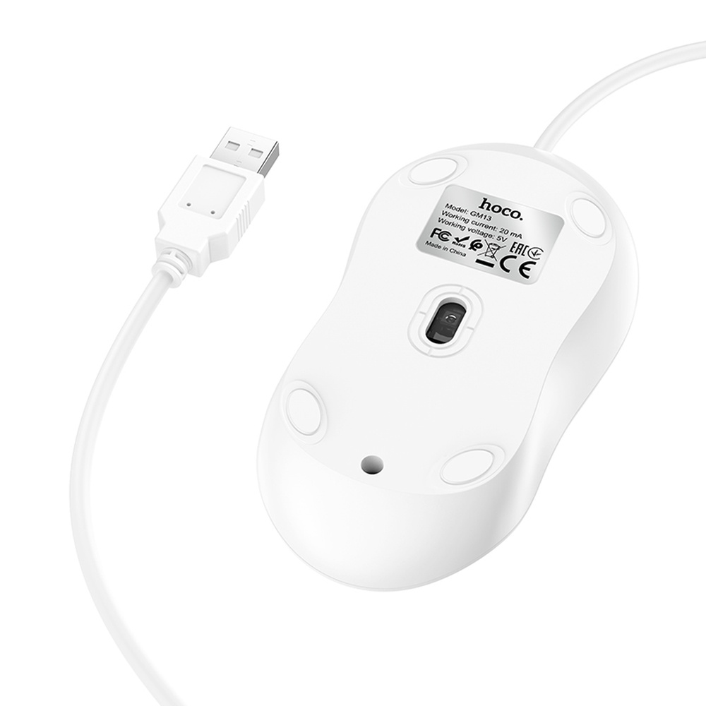 Un ratón de ordenador blanco con cable USB, la parte inferior muestra detalles.