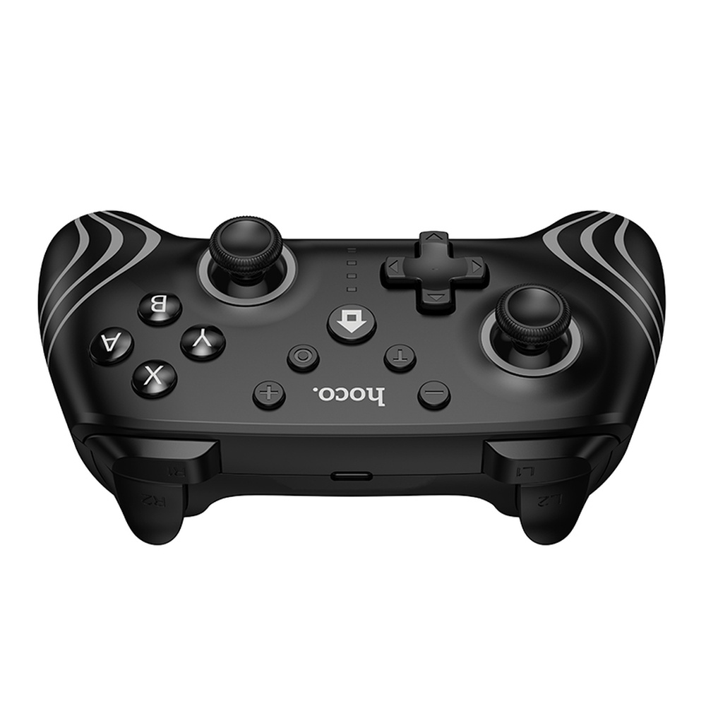Mando de juegos negro con dos joysticks, botones y cruceta. Logo Hoco.