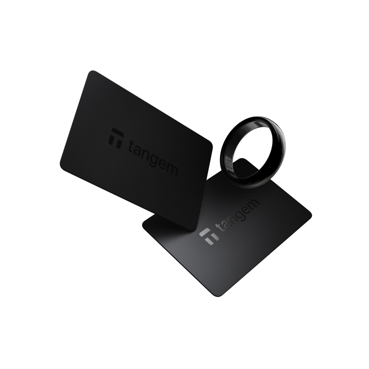 Dwie czarne karty z logo Tangem i czarny pierścień na białym tle.