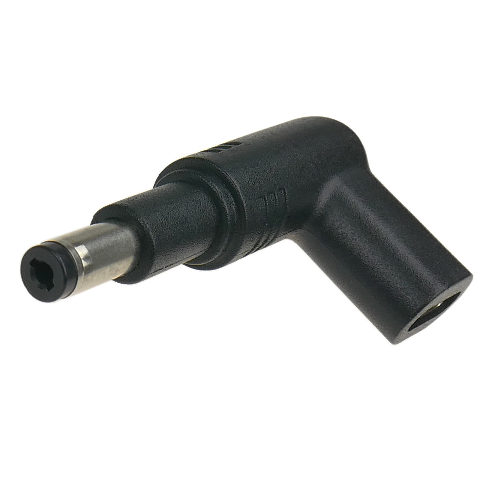 Czarny, L-kształtny złącze z cylindrycznym metalowym bolcem.