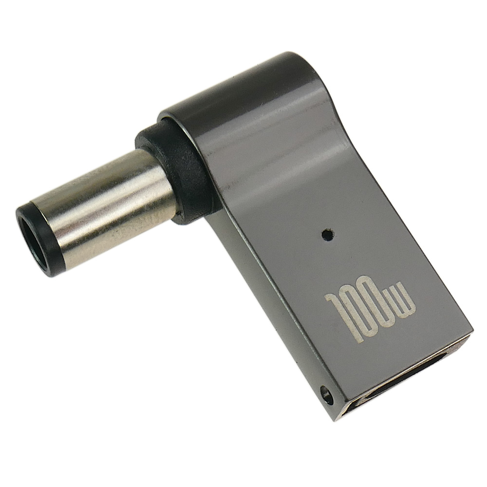 Srebrny adapter zasilania z oznaczeniem "100w" na białym tle.