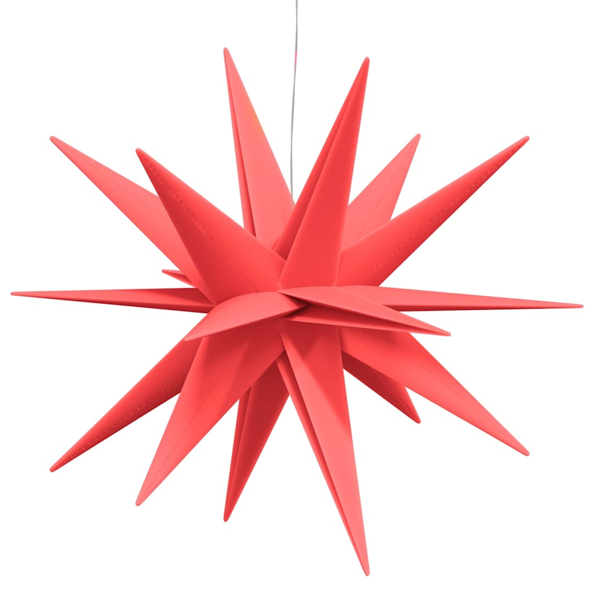 Ein roter, sternförmiger Weihnachtsstern hängt an einem Faden.