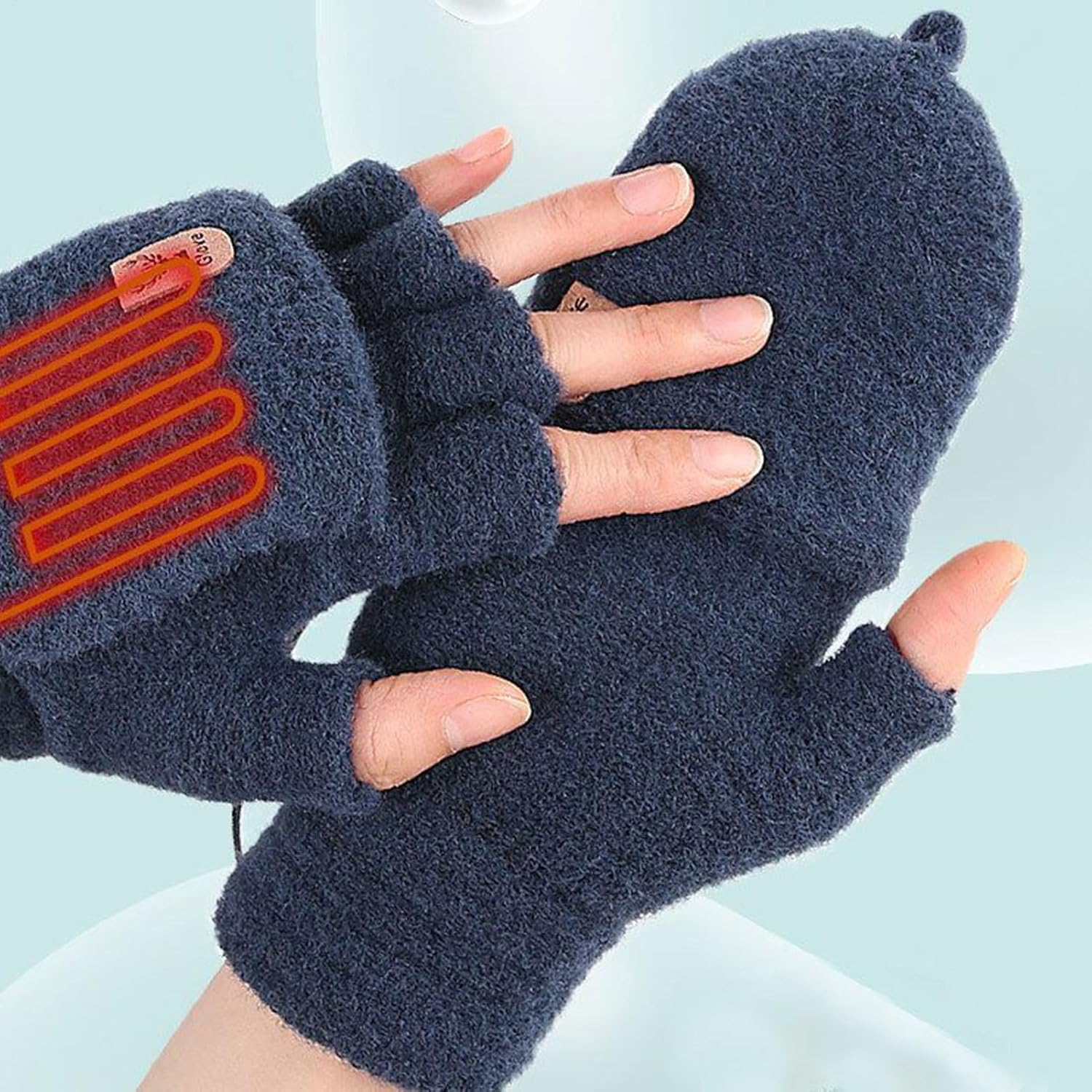 Blaue Fingerhandschuhe mit Heizfunktion, die Hände werden bedeckt.