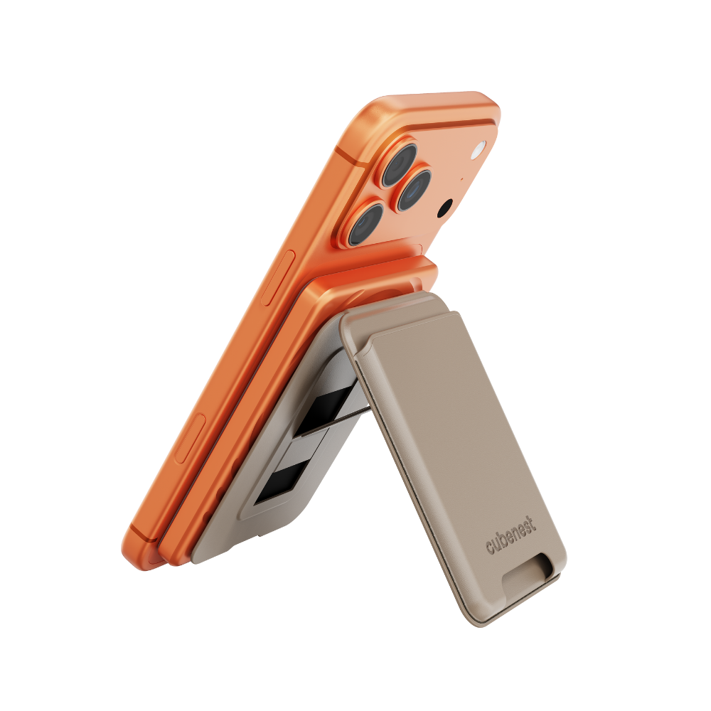 Ein orangefarbenes Smartphone ist auf einem beigefarbenen Ständer montiert.