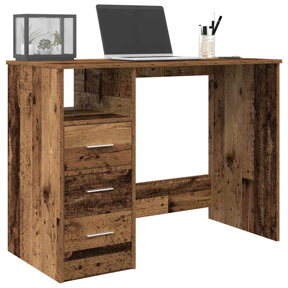 Ein Holztisch mit Laptop, Pflanzen und Stiften.