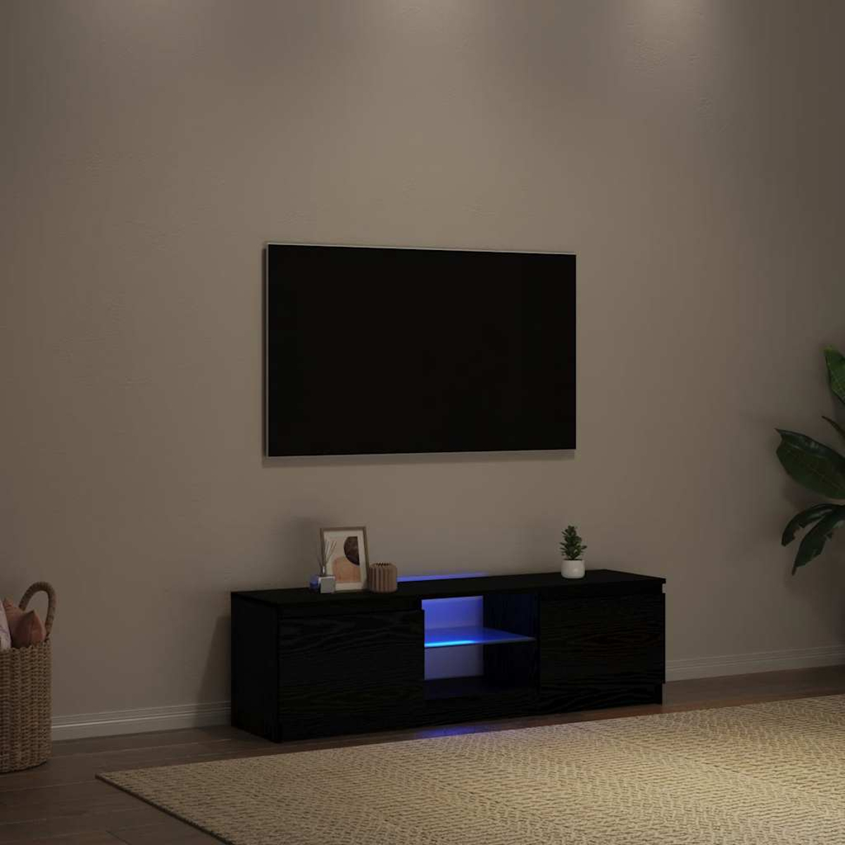 Ein schwarzer Fernseher ist über einem schwarzen TV-Ständer mit blauen LED-Lichtern an der Wand montiert.