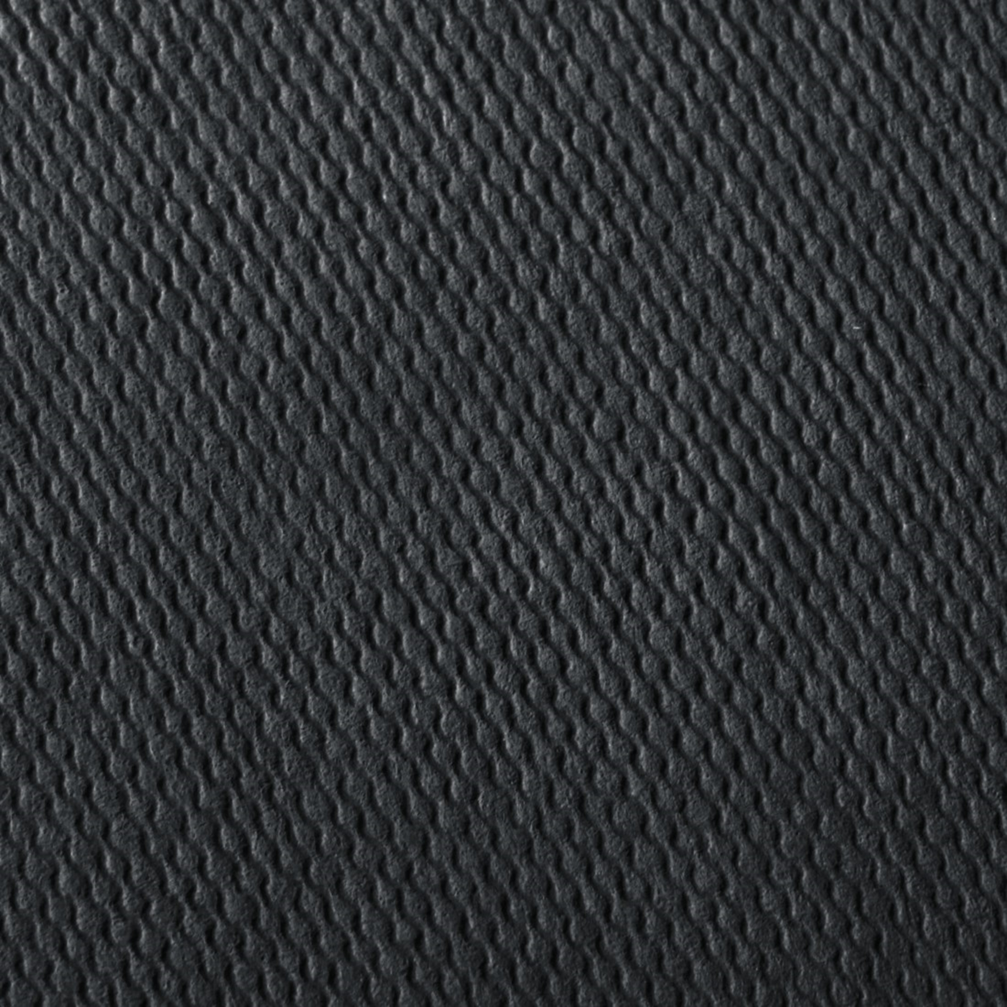 Ciemnoszara tekstura z falistym prążkowanym wzorem biegnącym po przekątnej.