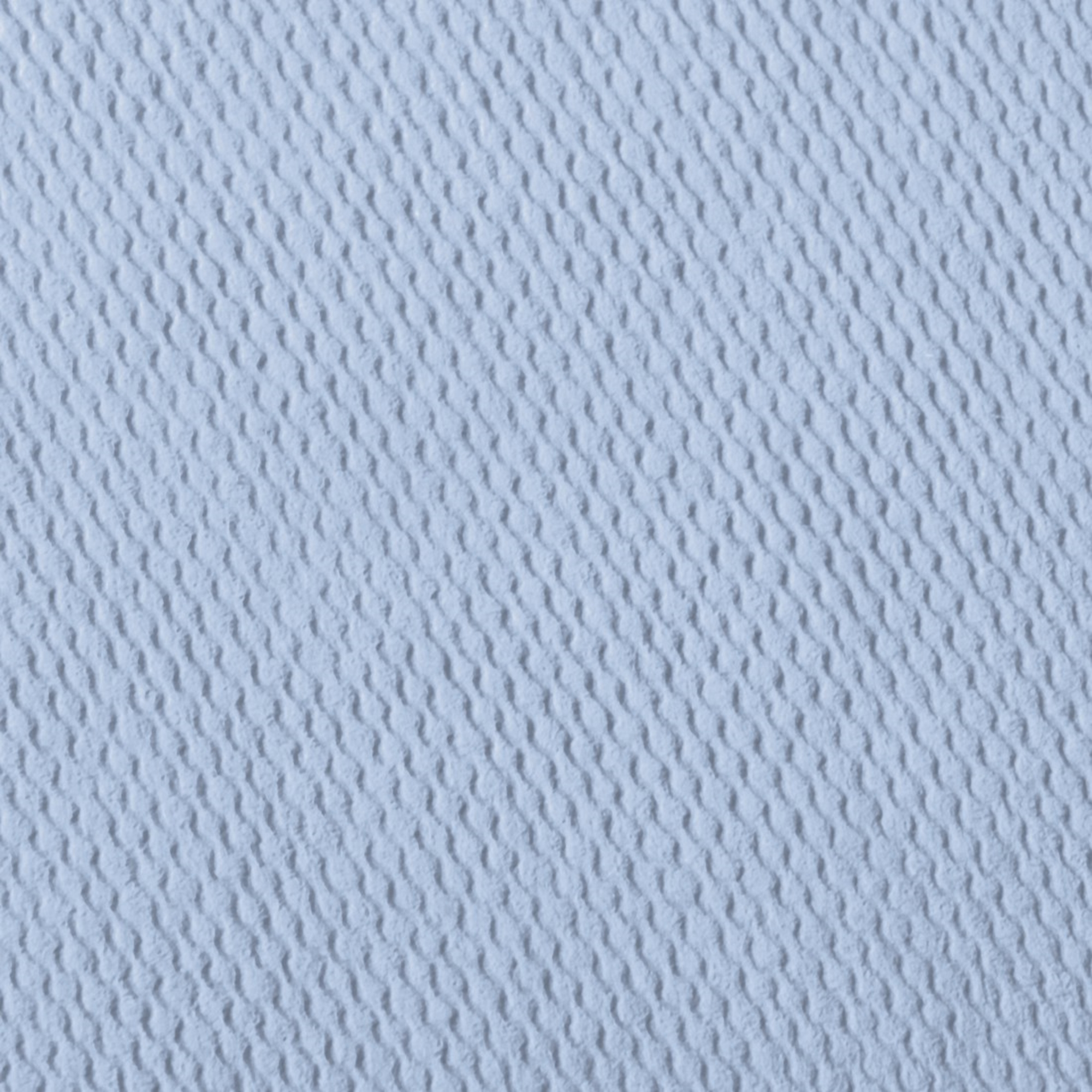 Zbliżenie jasnoniebieskiej, fakturowanej powierzchni z równoległymi grzbietami.