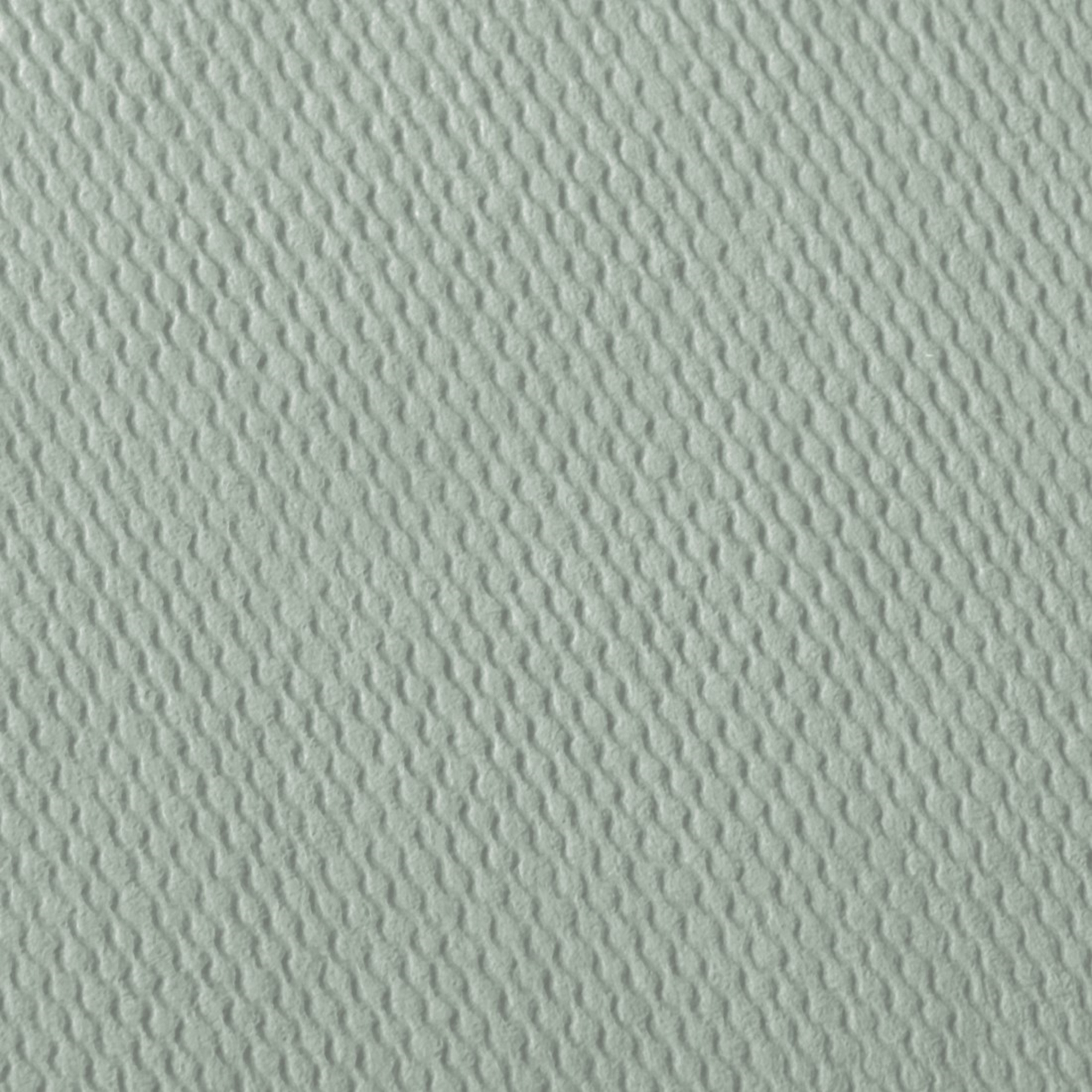 Zbliżenie na jasnoszarą, teksturowaną powierzchnię z falistym wzorem.