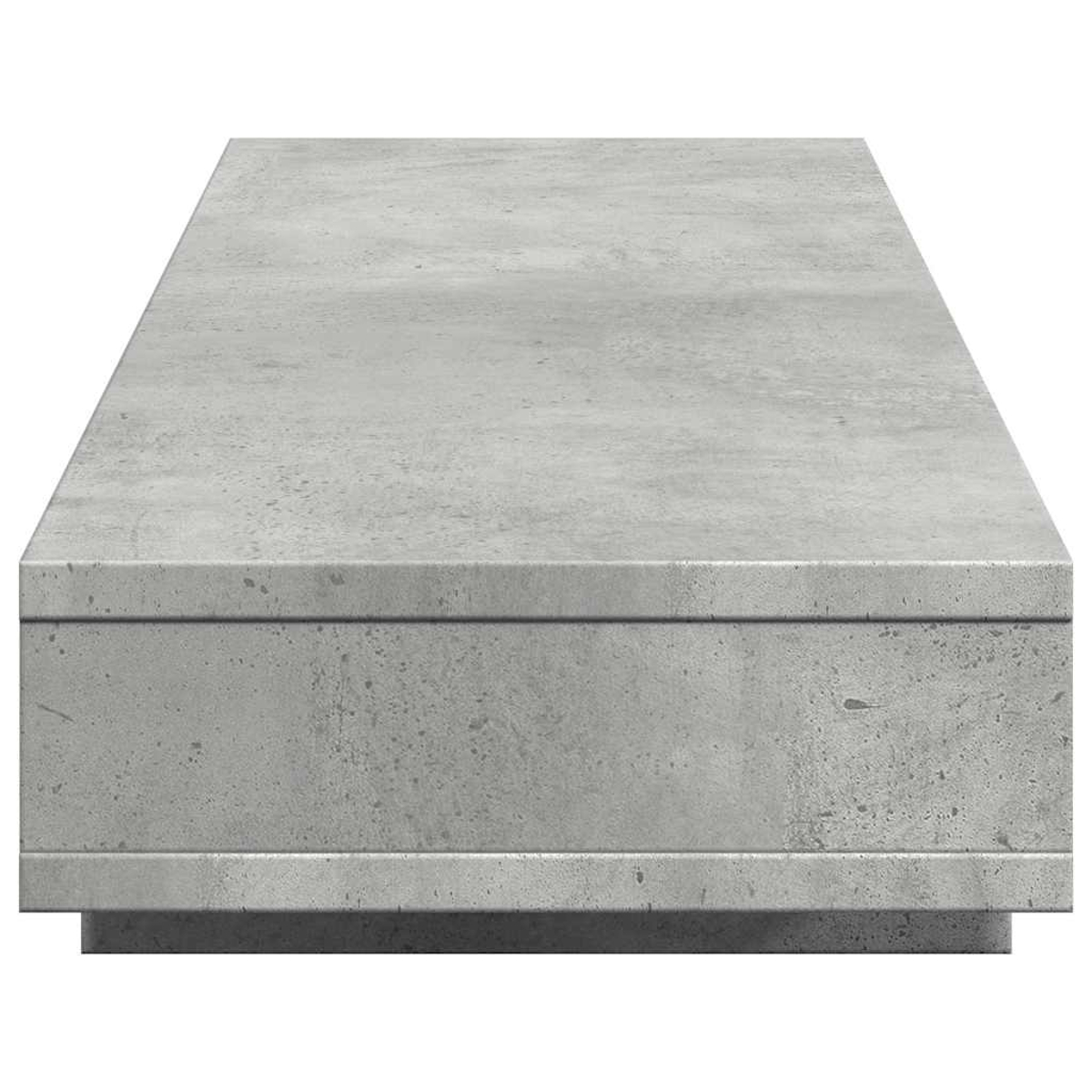 Ein rechteckiger Betontisch mit einer glatten Oberfläche und scharfen Kanten.