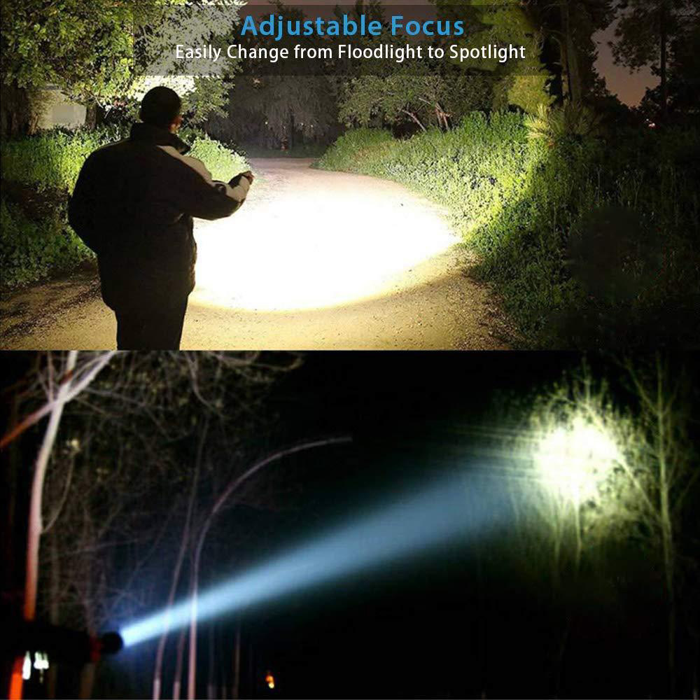 Mann mit Taschenlampe auf Weg; Strahl beleuchtet Bäume bei Nacht.
