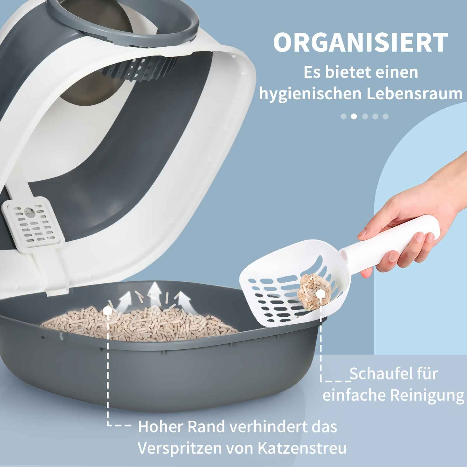 Graue und weiße Katzentoilette mit Streu und Schaufel. Hoher Rand.