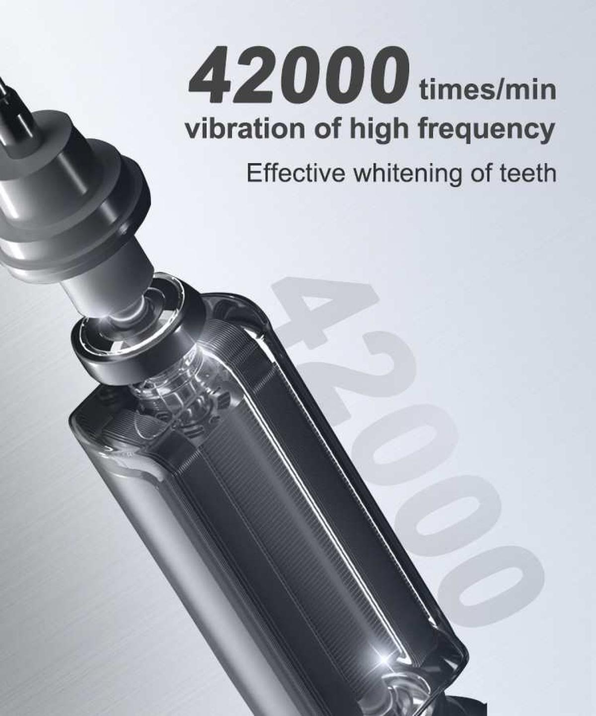 Nahaufnahme eines metallischen Geräts mit der Aufschrift 42000 Vibrationen/min für Zahnaufhellung.
