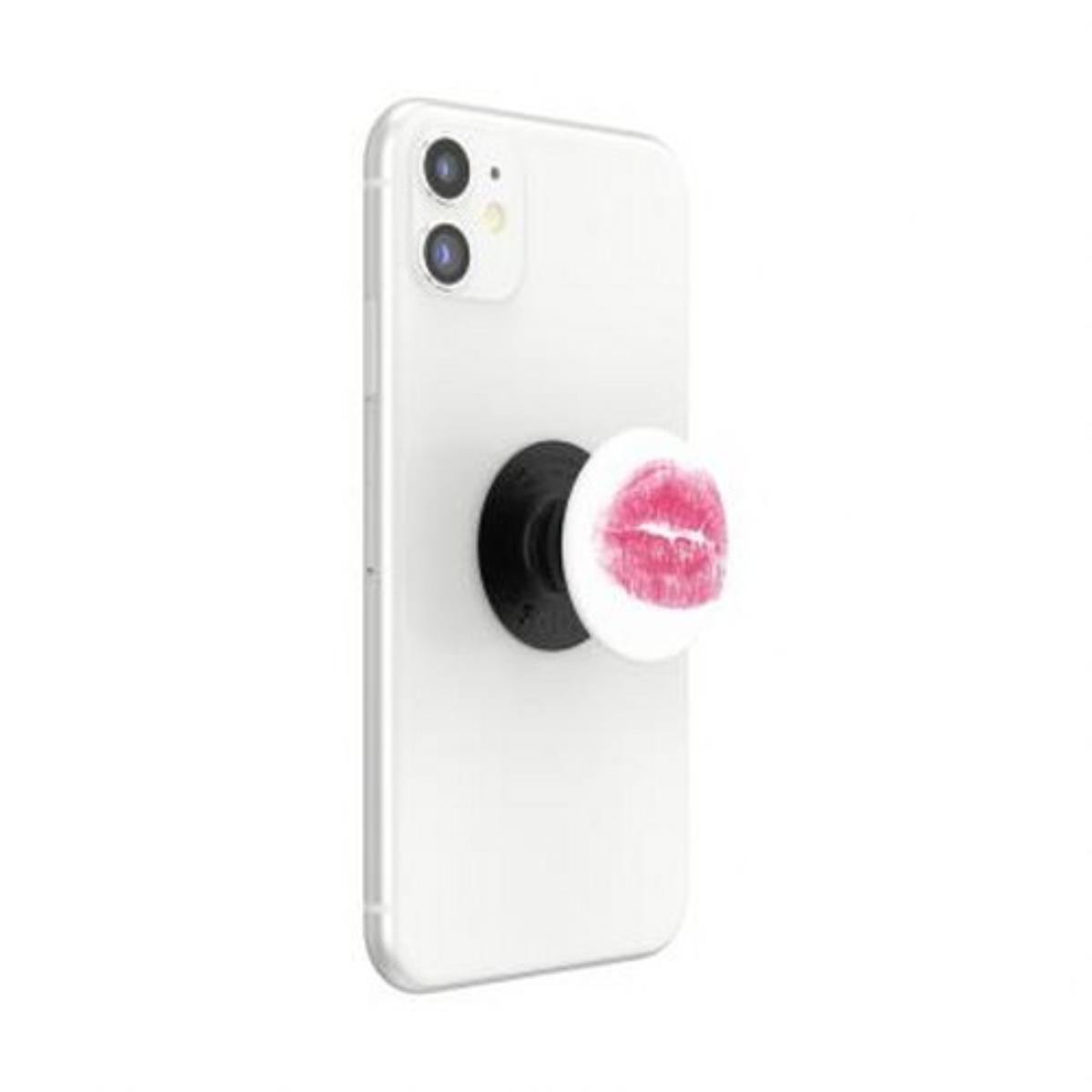 Uno smartphone bianco con pop socket con impronta di rossetto rosso.