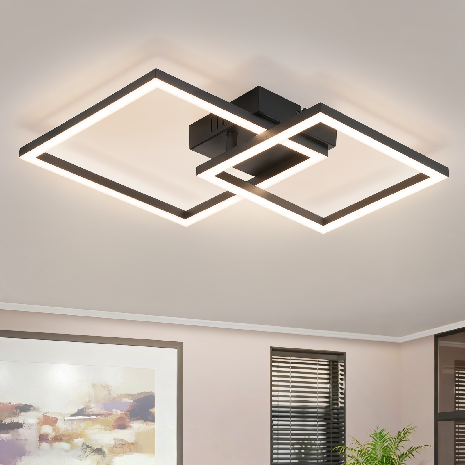 Lampada da soffitto moderna nera con due cornici quadrate intrecciate illuminate.