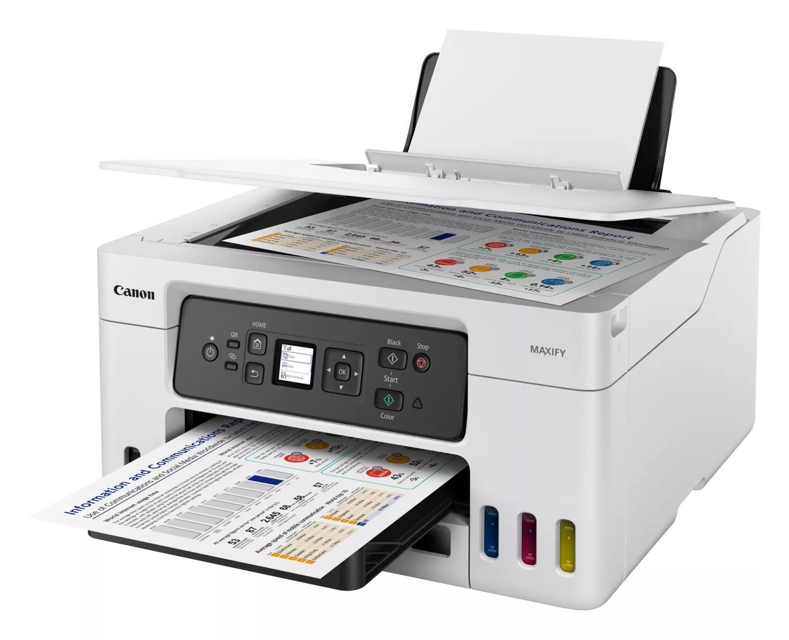 Une imprimante Canon MAXIFY blanche avec son scanner ouvert, imprimant des rapports.