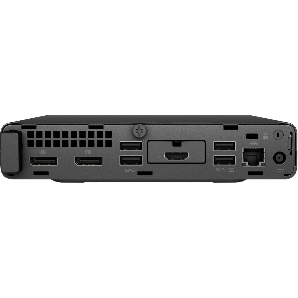 Rear view of a black mini PC with multiple ports, including USB and network.