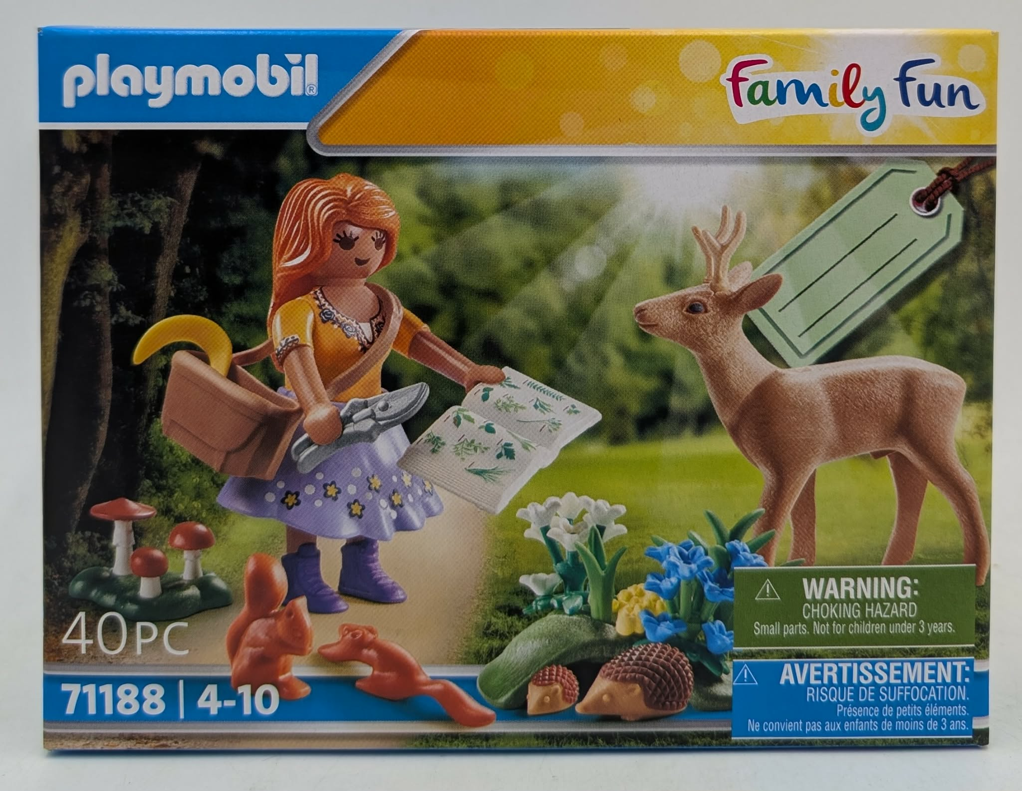 Zestaw Playmobil z figurką dziewczynki, jeleniem, wiewiórką, grzybami i kwiatami.