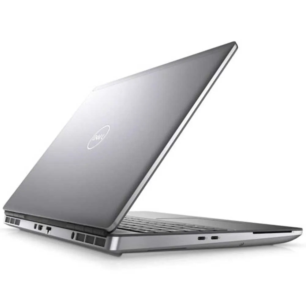 Un ordinateur portable Dell argenté est ouvert, sur fond blanc.