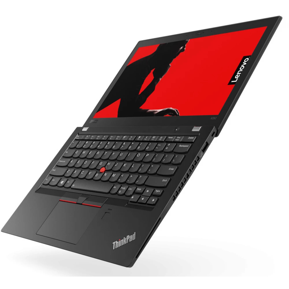 Ordinateur portable noir avec fond rouge et silhouette.